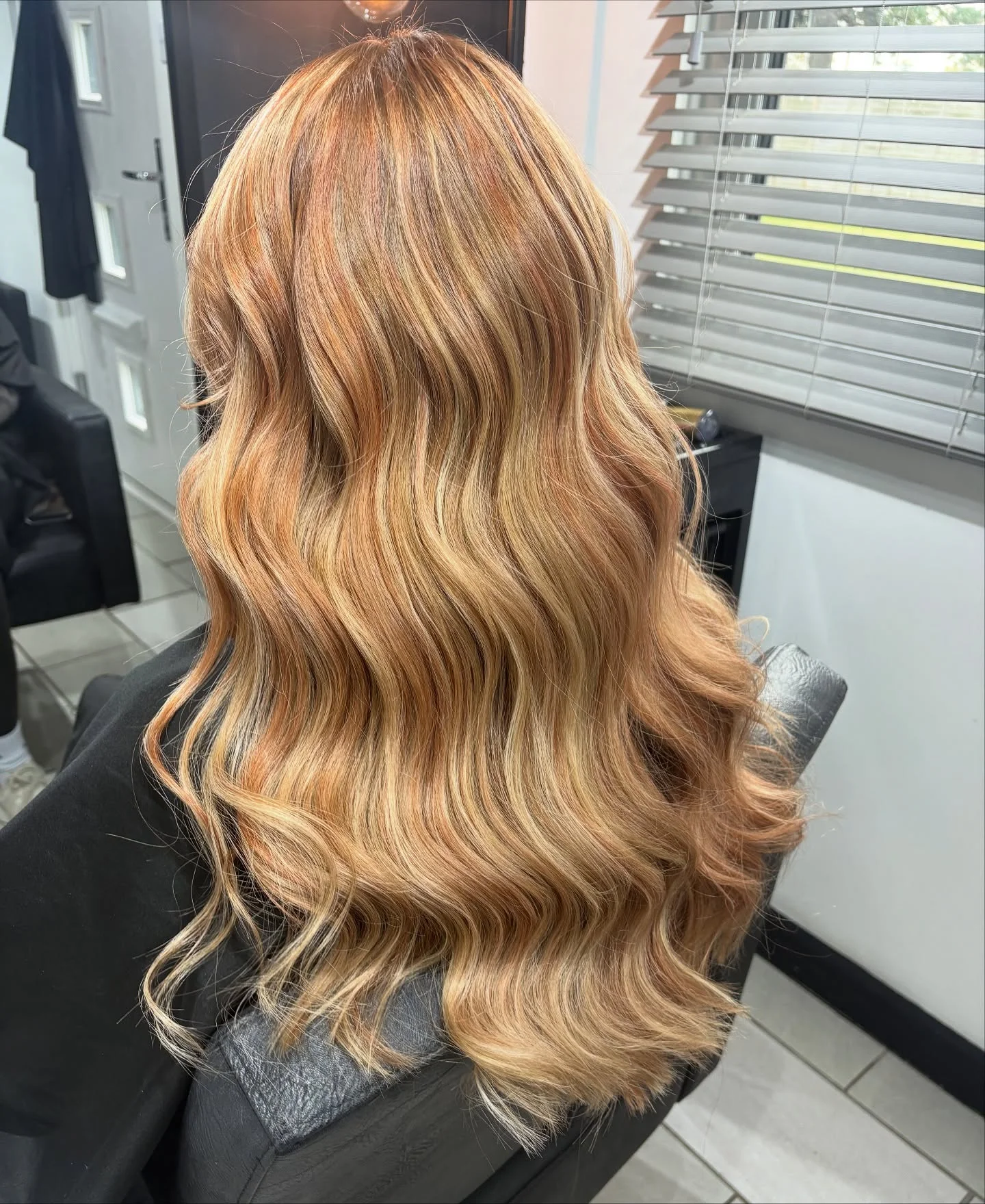 lived-in summer strawberry blonde hair color 2026 Honey Melt Strawberry Blonde With Loose Luxe Waves