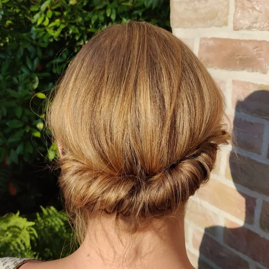 minimal summer easy hairstyle 2026 Minimal Twisted Low Bun With Glossy Honey Blonde Shine