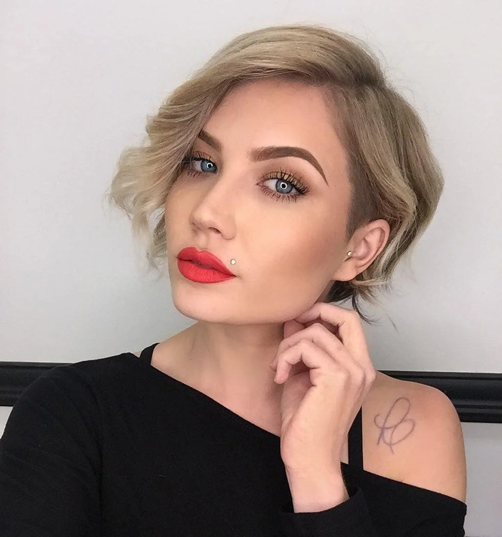 best summer short hairstyles 2026 French-Inspired Wavy Bob With Soft Blonde Volume