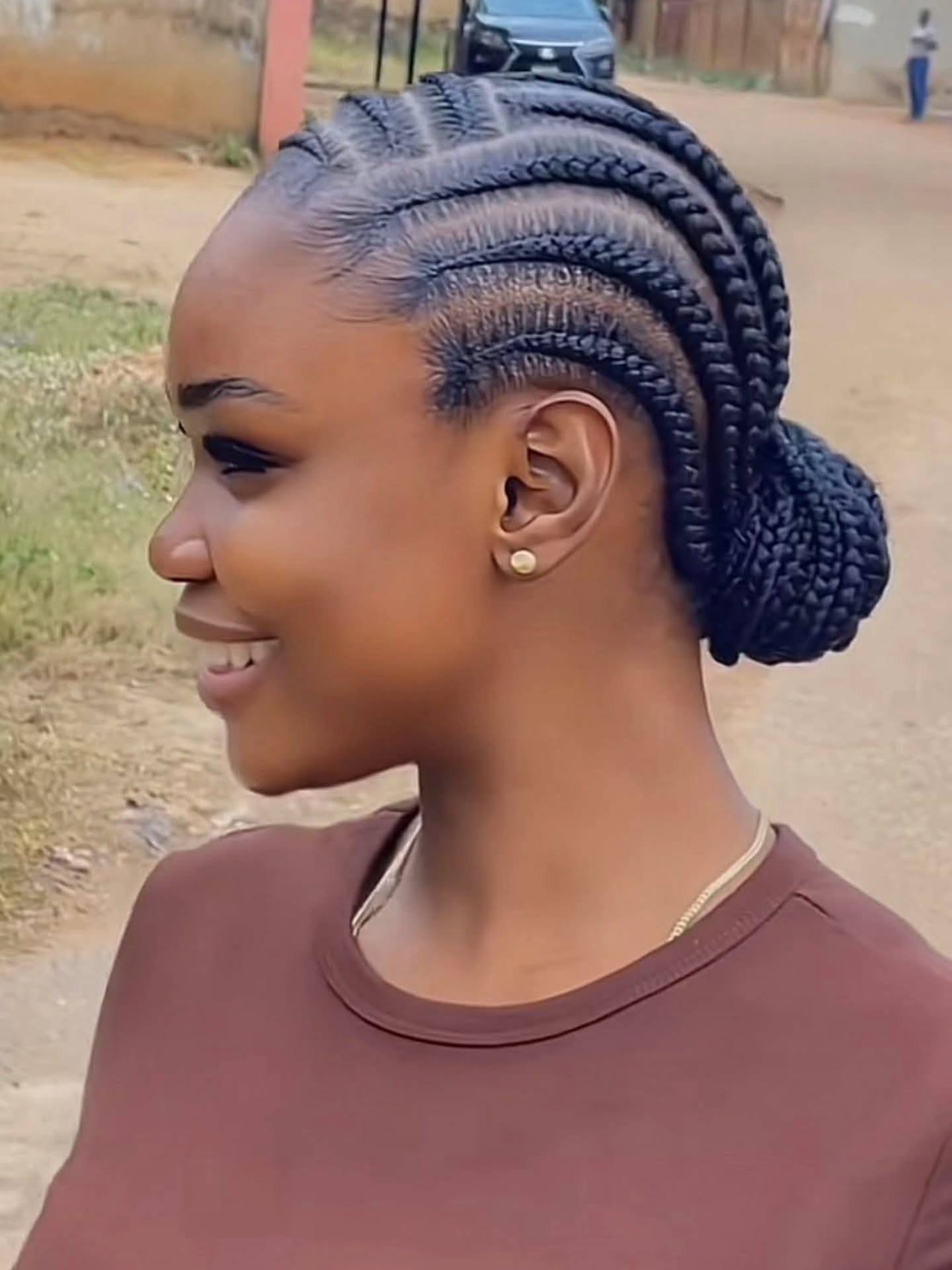 regal summer hairstyle black women 2026 Low Regal Braided Bun With Clean Cornrow Layers