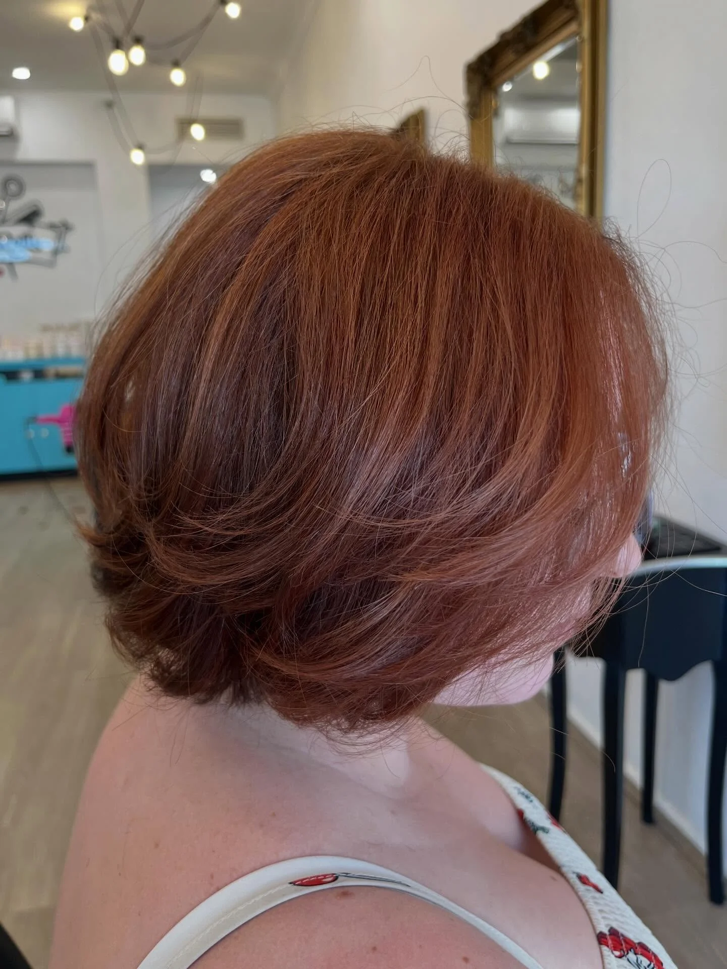 salon summer haircuts for plus size women 2026 Rounded Copper Short Bob With Soft Volume