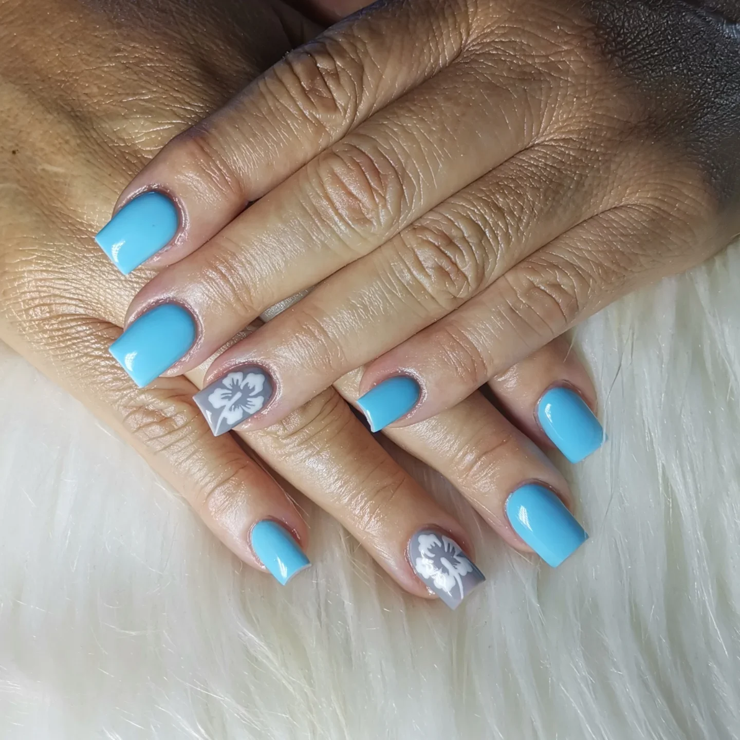 summer acrylic nails 2026 Soft Turquoise Acrylic Nails With Tropical Floral Accents
