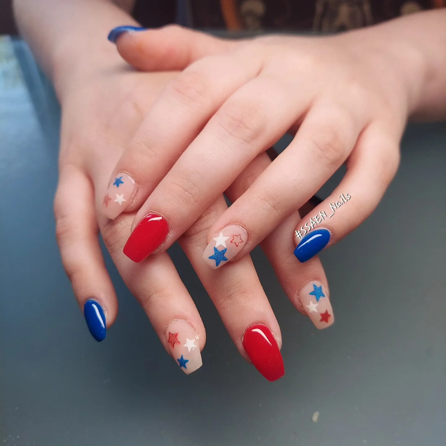 4th of july nails 2026 Glossy Patriotic Star Nails With Minimal Nude Base