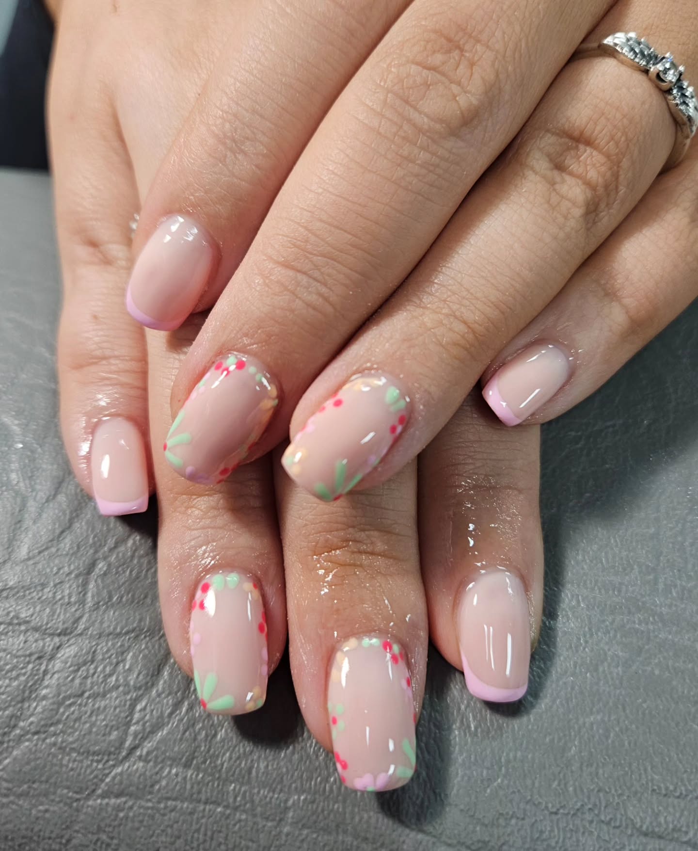 light summer nails 2026 Pastel Confetti French Tips With Soft Floral Details