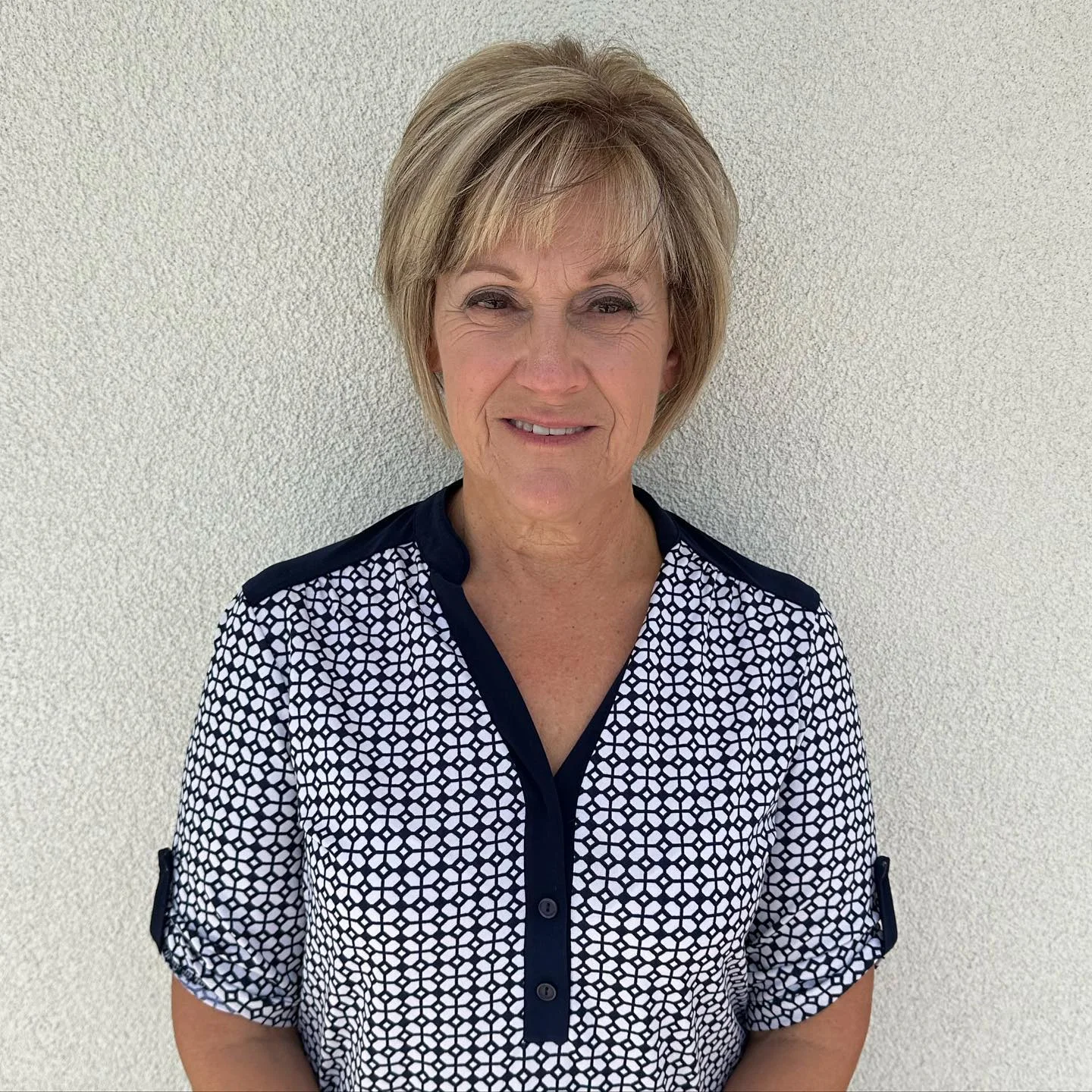 stylish summer haircuts for women over 60 2026 Soft Tapered Pixie With Feathered Bangs