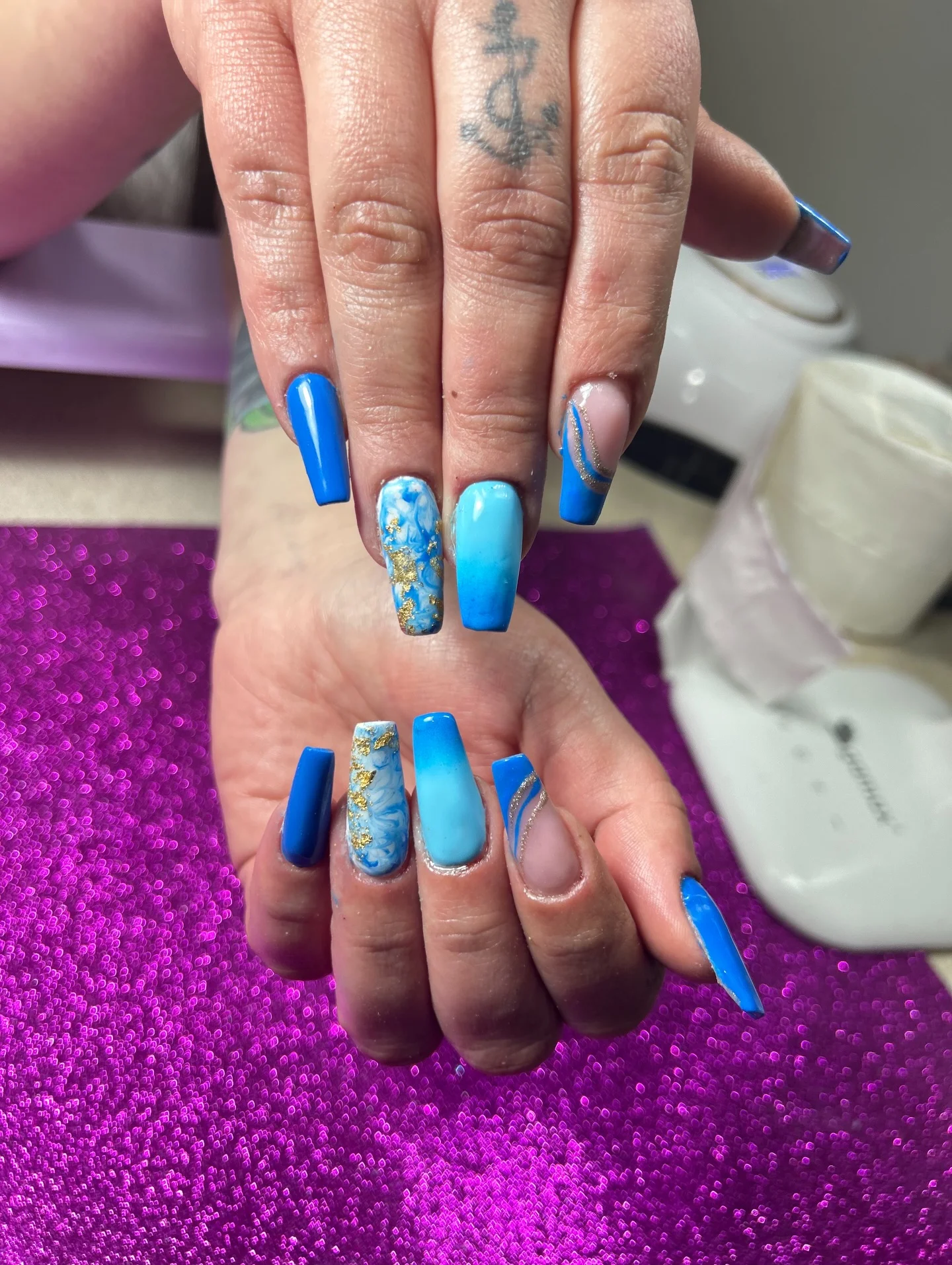 summer nails ballerina shape 2026 Ocean Marble Blue Nails With Gold Foil Details