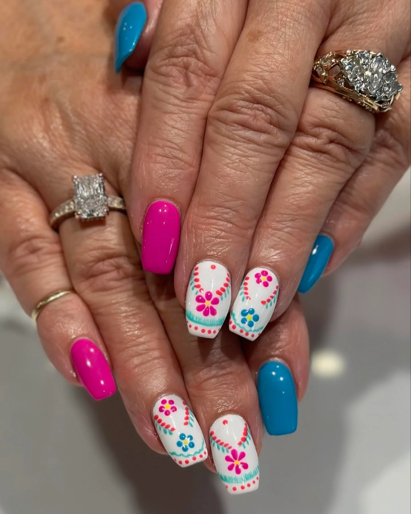 summer vibrant nails 2026 Hot Pink And Ocean Blue Folk Floral Nails