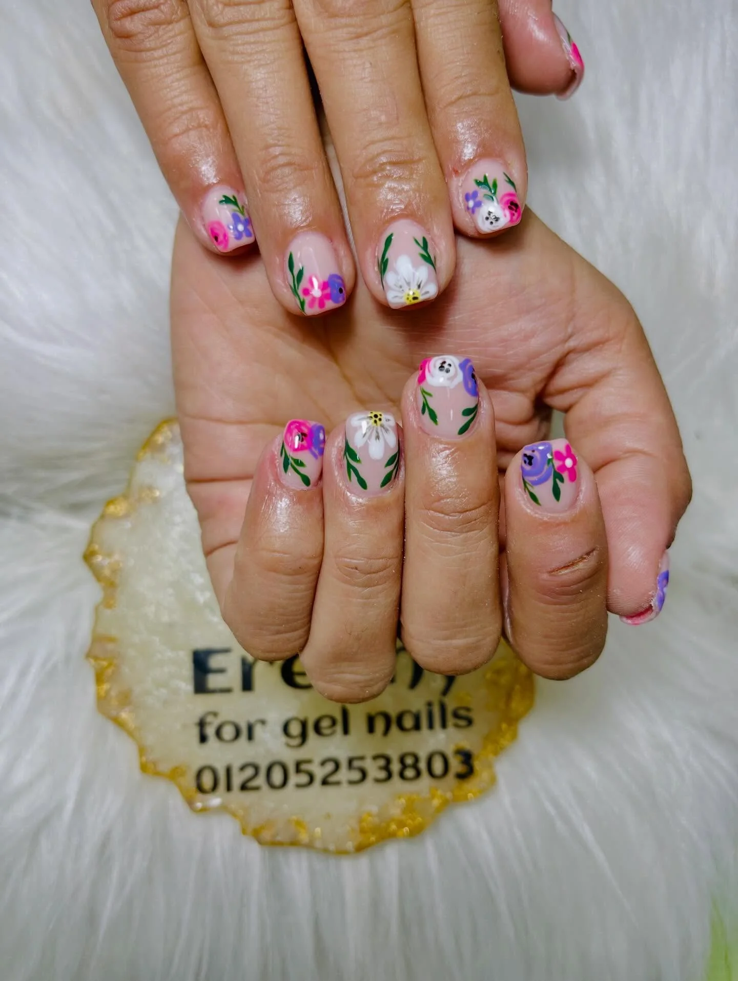 short summer nails 2026 Tiny Wildflower Garden Nails On Glossy Nude Base
