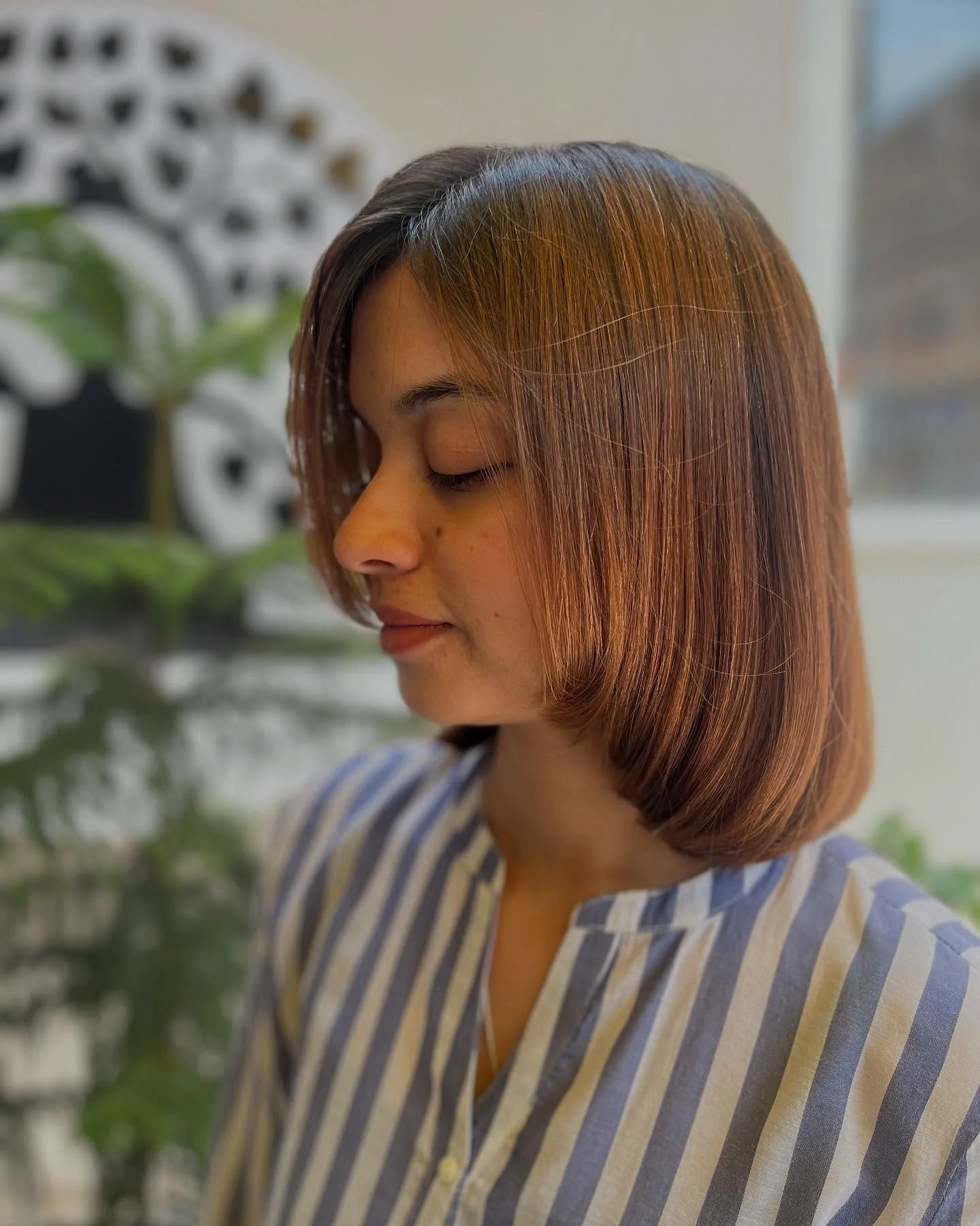 sophisticated summer haircuts for women over 40 2026 Soft Copper Classic Bob With Side Part