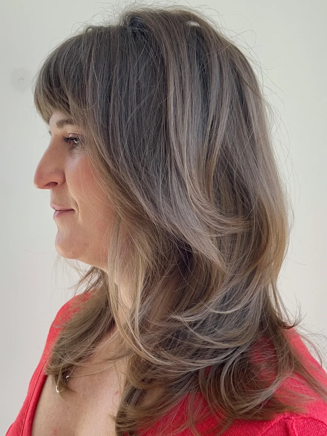 summer-haircuts-women-over-50 Voluminous Feathered Layers With Side Bangs