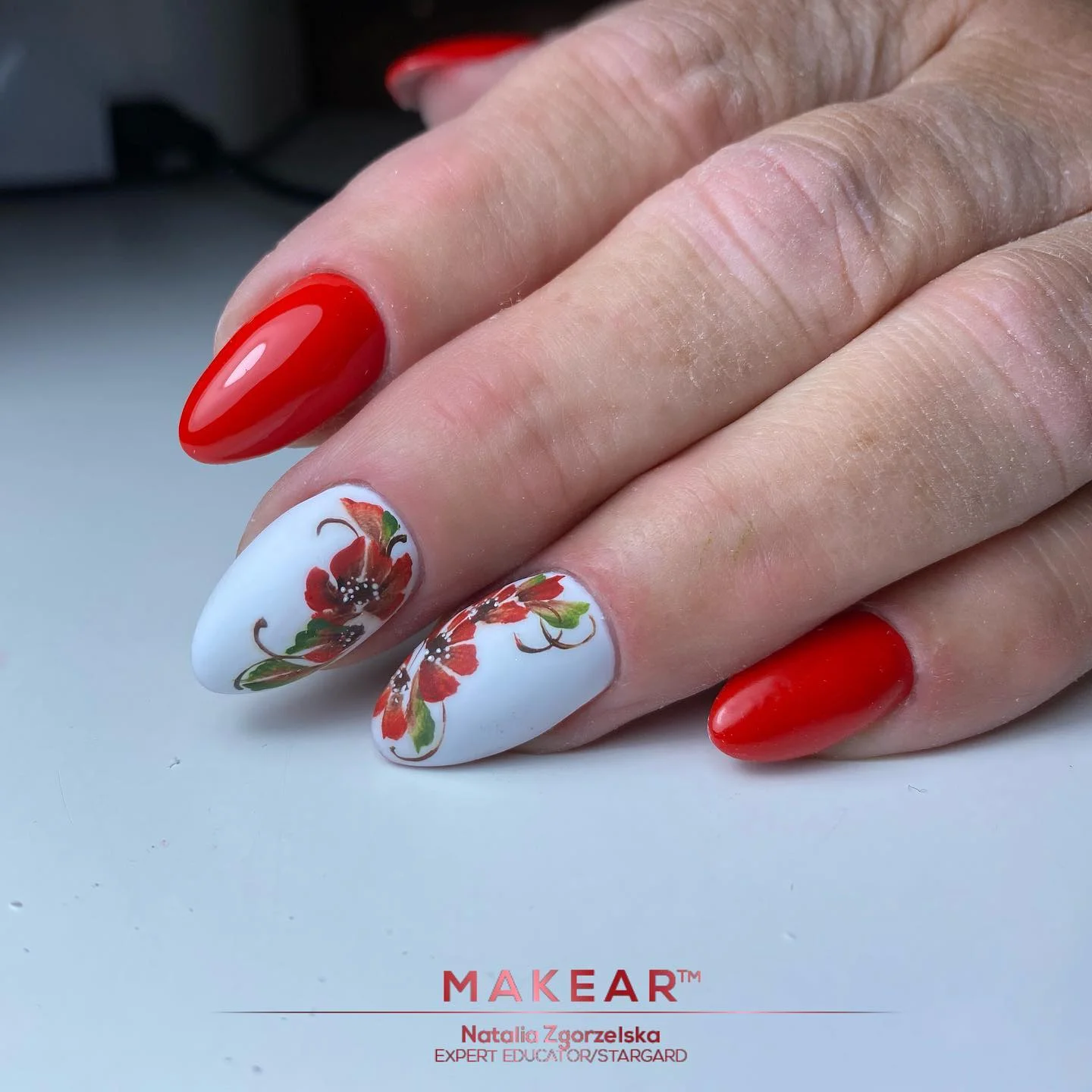 summer flower nails 2026 Glossy Red Floral Nails That Feel Bold And Vintage