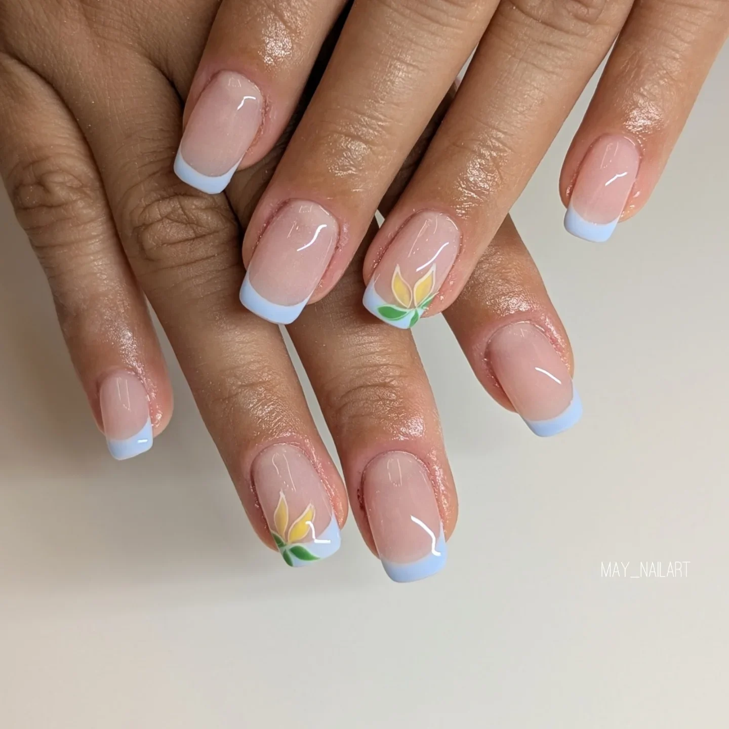 summer nail inspo 2026 Baby Blue French Tips With Minimal Floral Accents