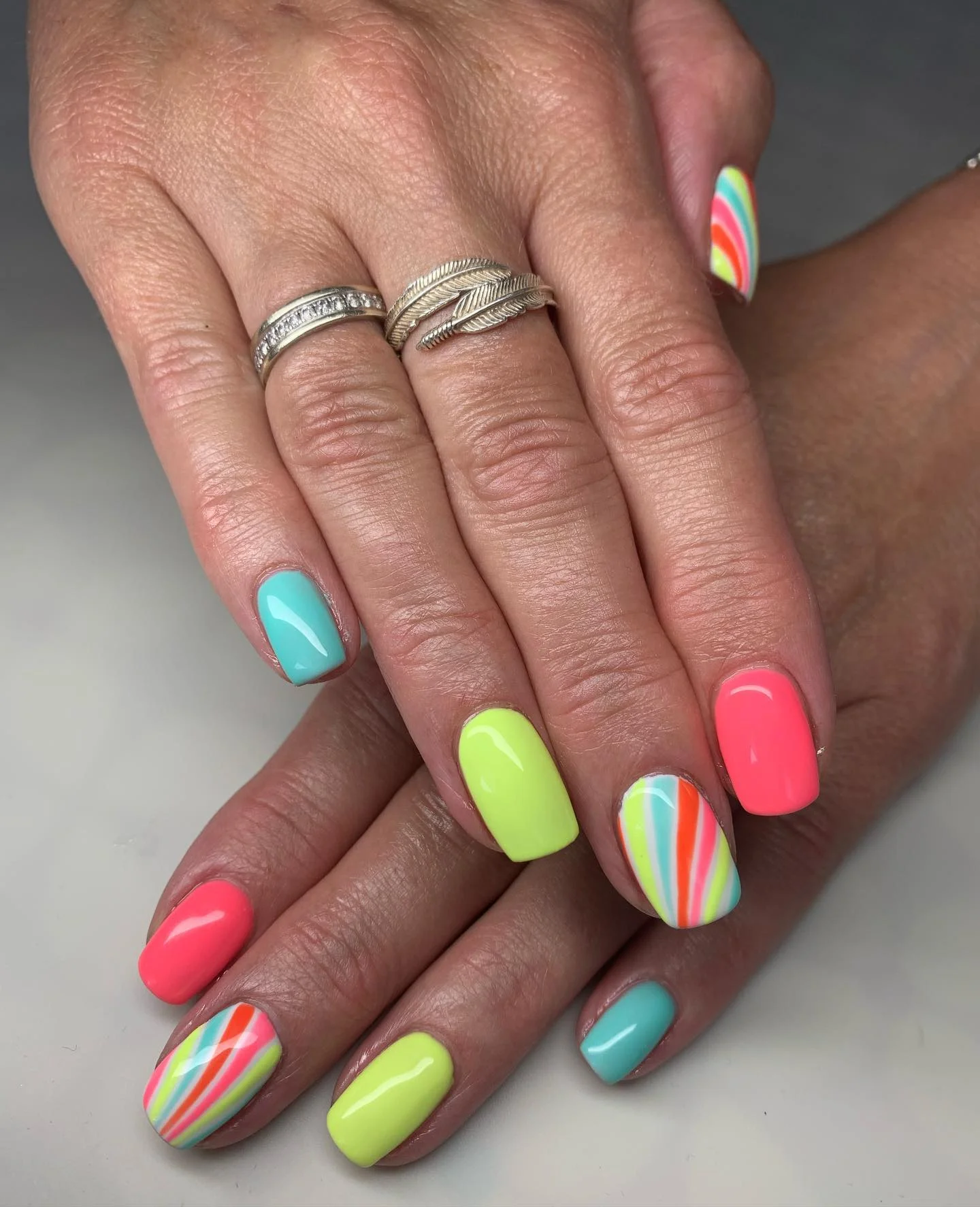 bright summer nails 2026 Pastel Neon Swirls For A Retro Summer Mood