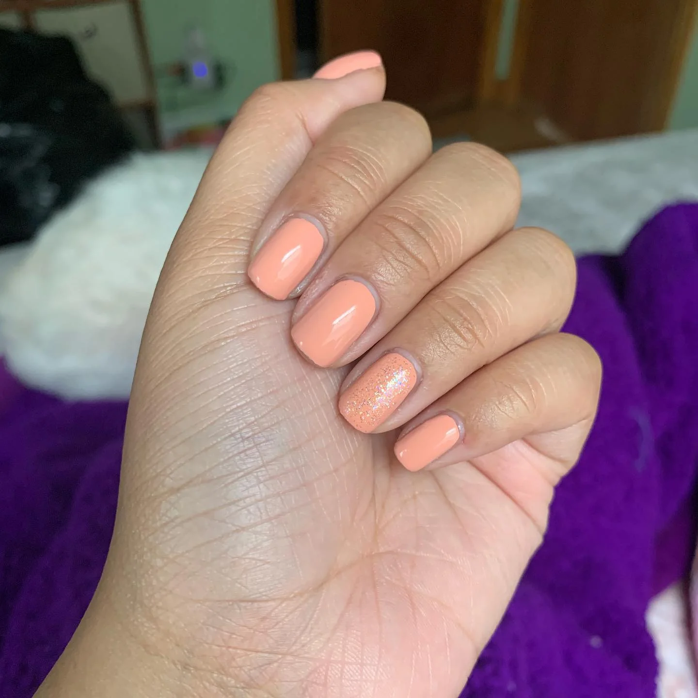 june nail colors 2026 Peach Sorbet Nails With A Soft Glitter Accent