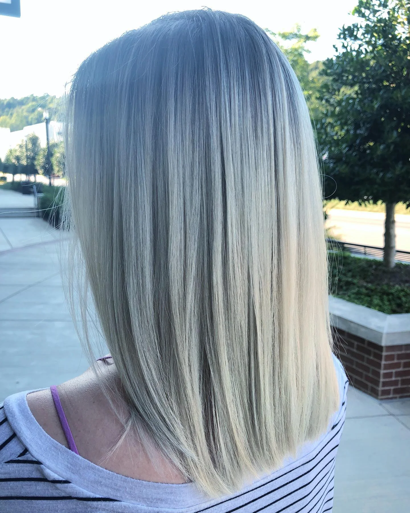 light summer haircuts for medium hair 2026 Cool Platinum Straight Cut With Clean Edges