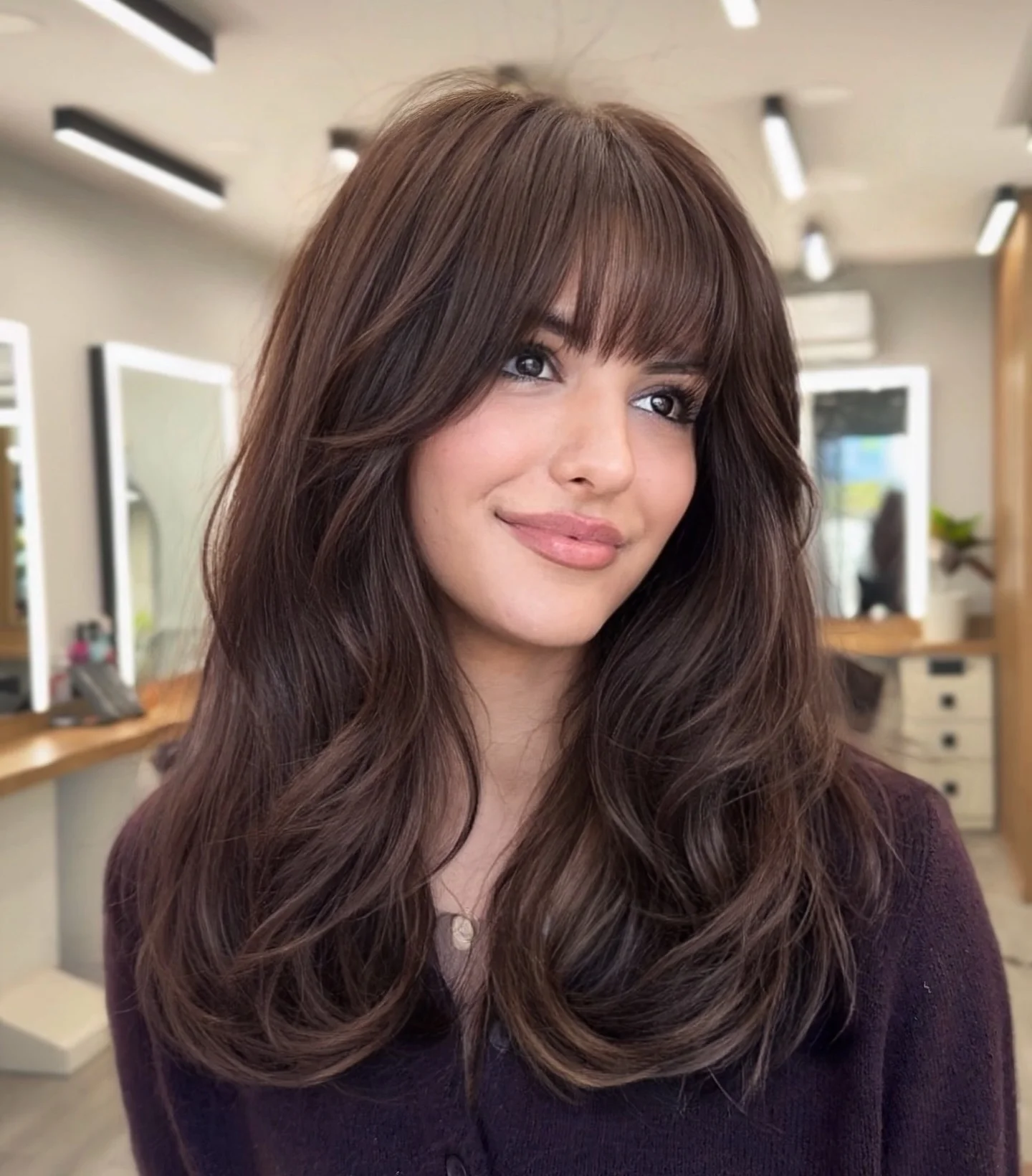 perfect summer haircut 2026 Layered Chocolate Waves With Wispy Bangs