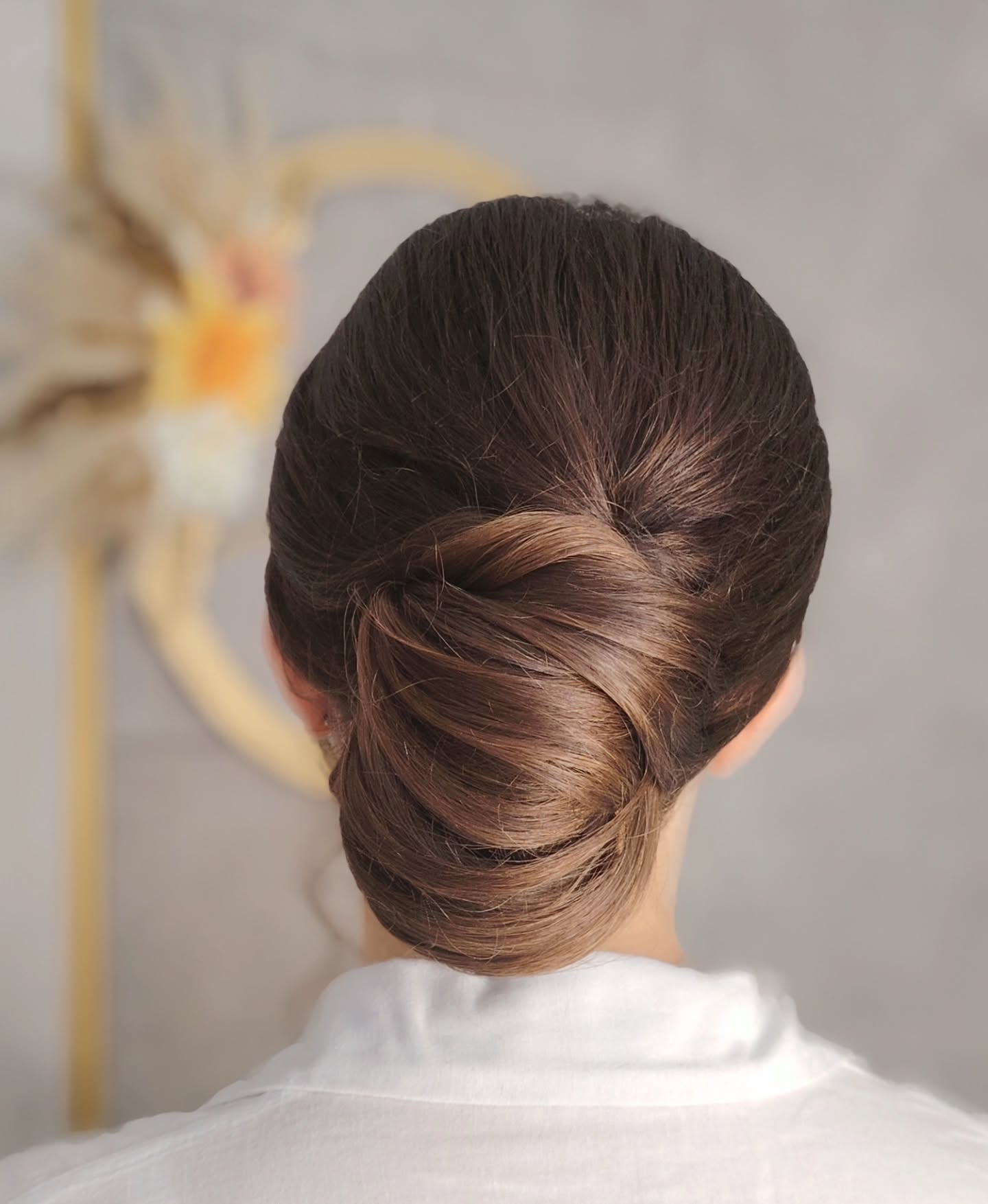 summer hairstyles ideas 2026 Minimalist Twisted Low Bun For Hot Summer Days