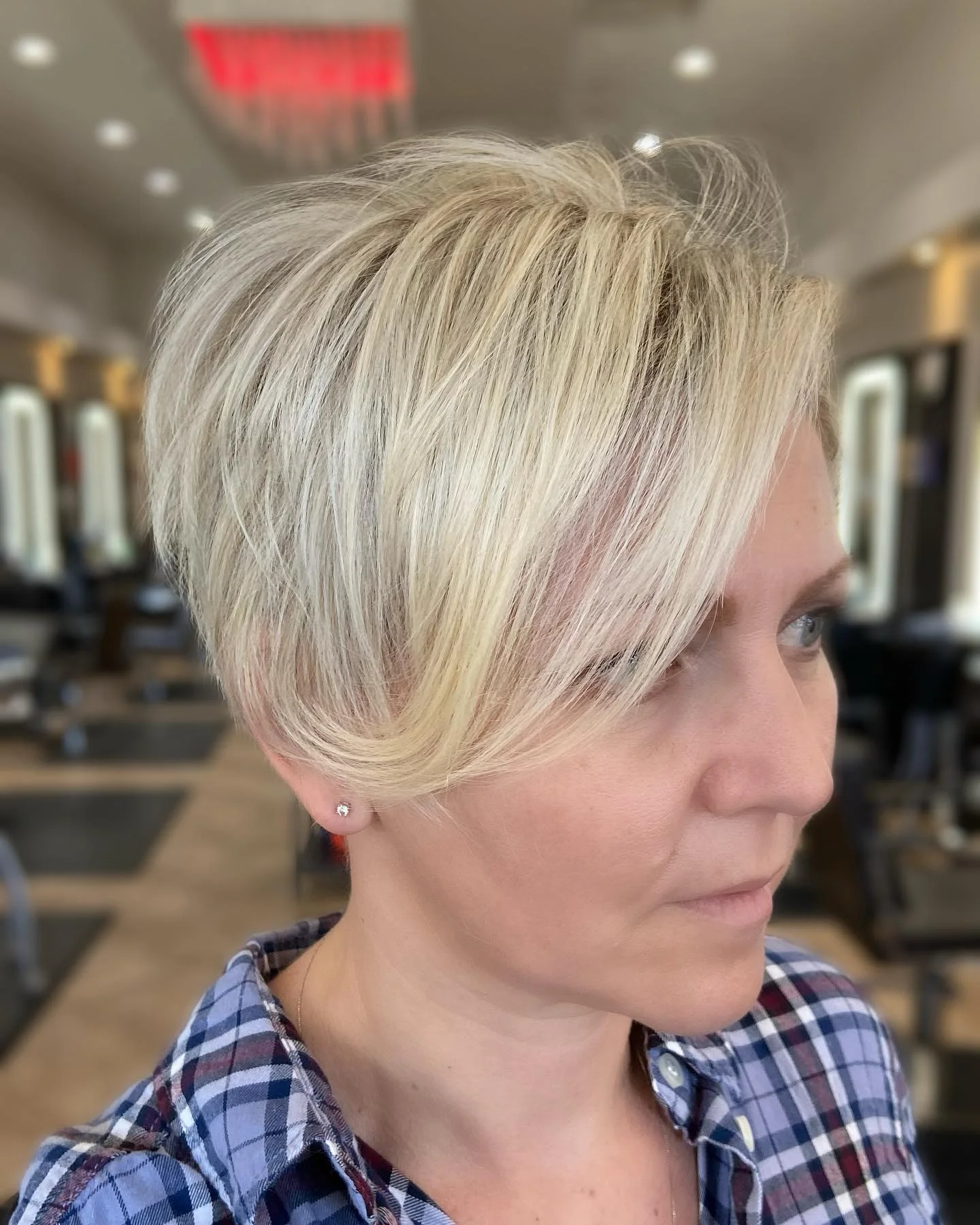 sleek summer short haircuts 2026 Airy Side Swept Pixie With Light Layers