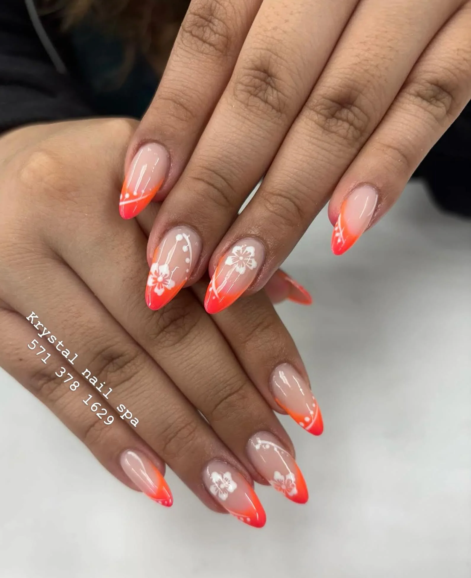 summer acrylic nails 2026 Neon Coral French Tips With Minimal White Floral Art