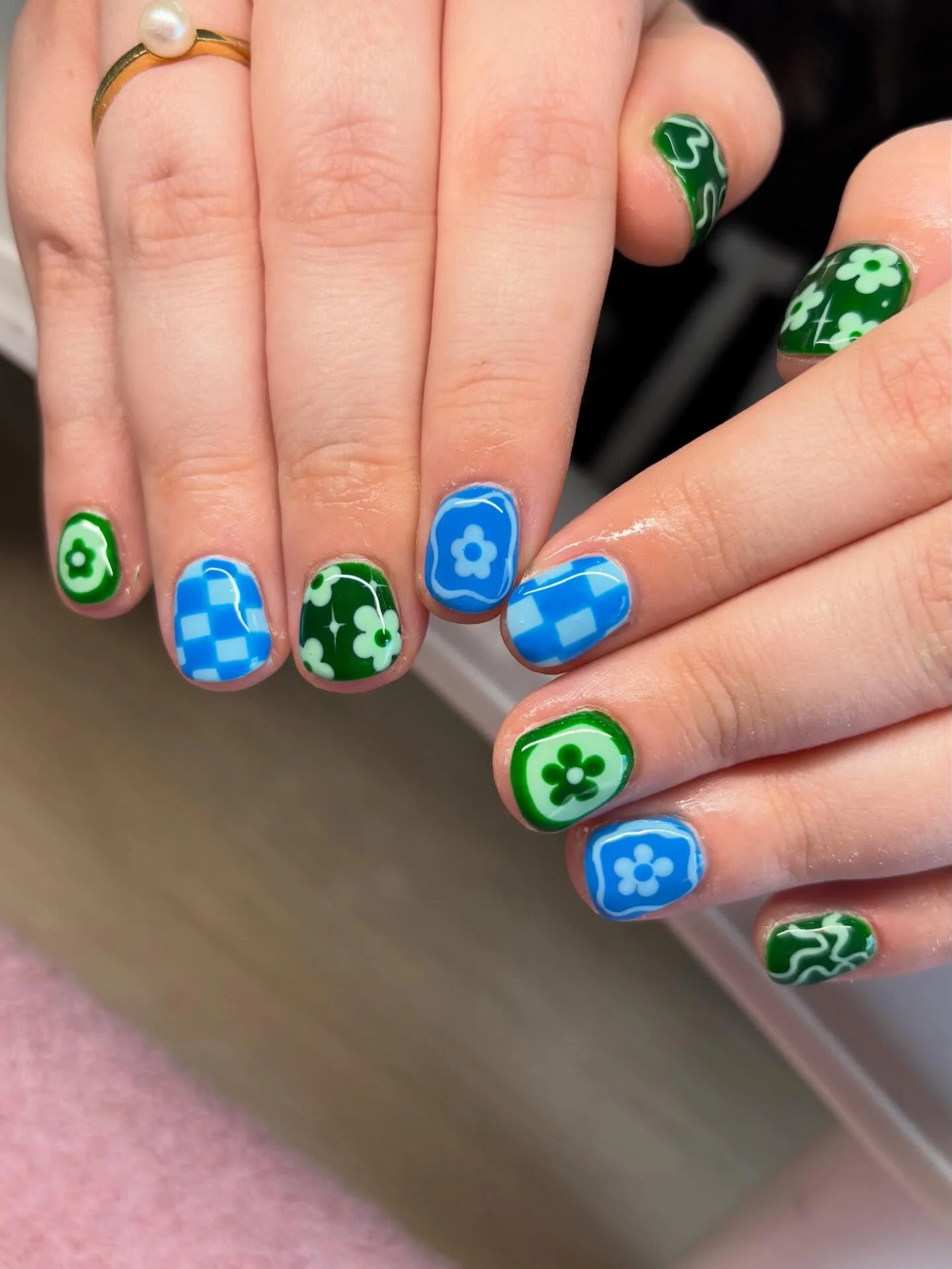 funky summer nails 2026 Blue And Green Floral Graphics With Retro Charm