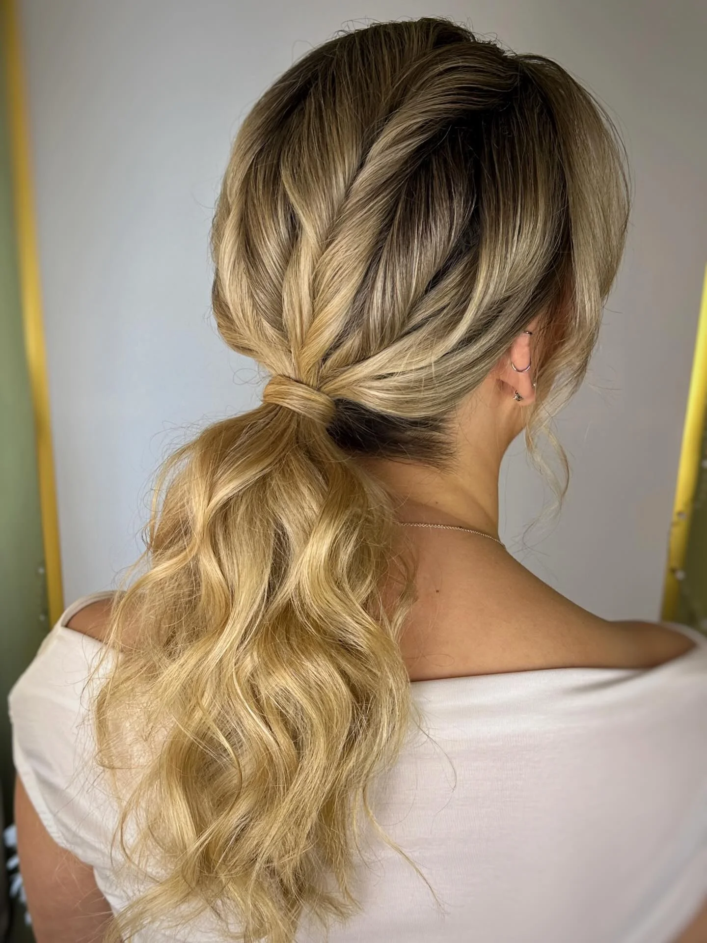 polished summer ponytail hairstyle 2026 Dimensional Blonde Ponytail With Wrapped Twist Detail