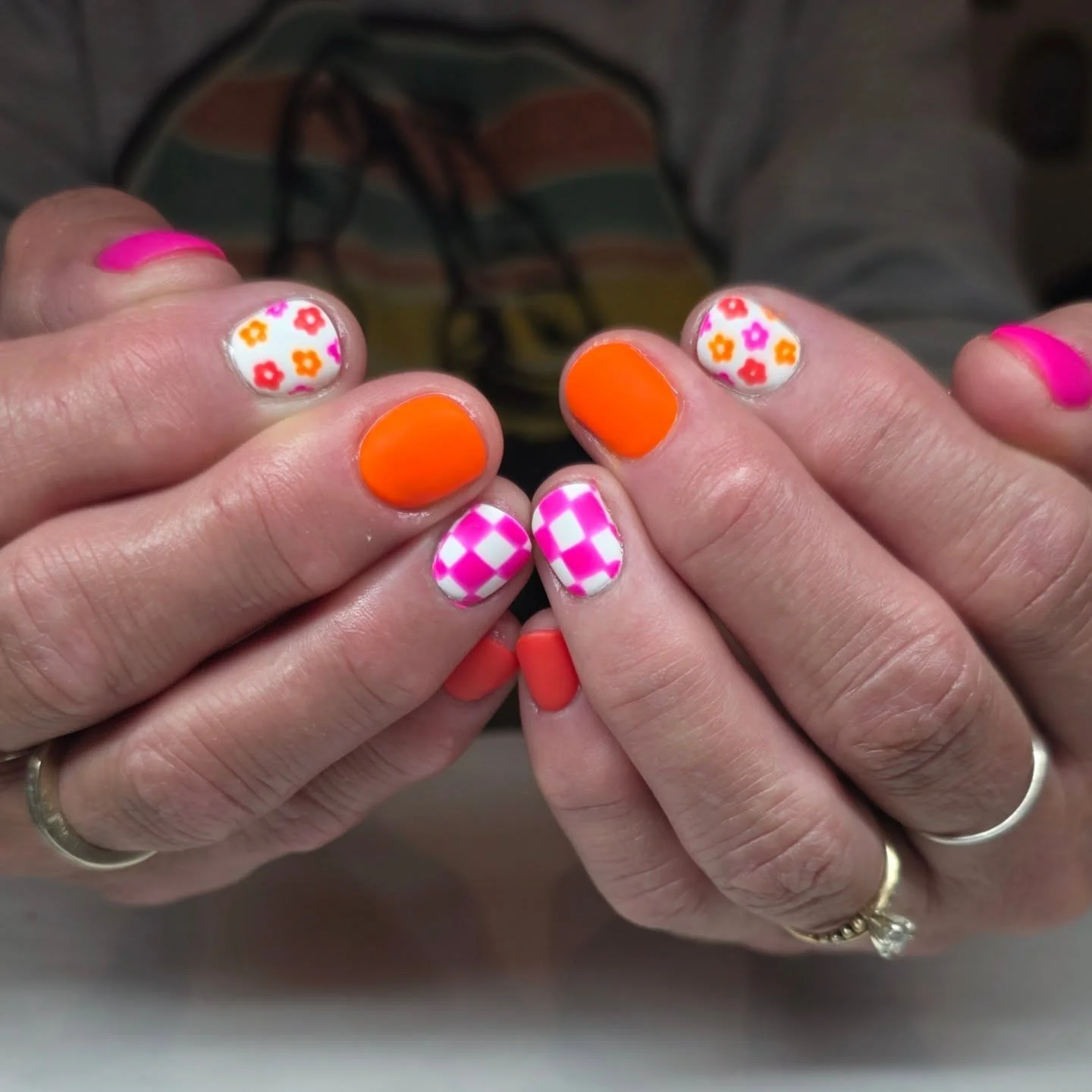 short summer nails 2026 Neon Checkerboard And Daisy Pop Art Nails