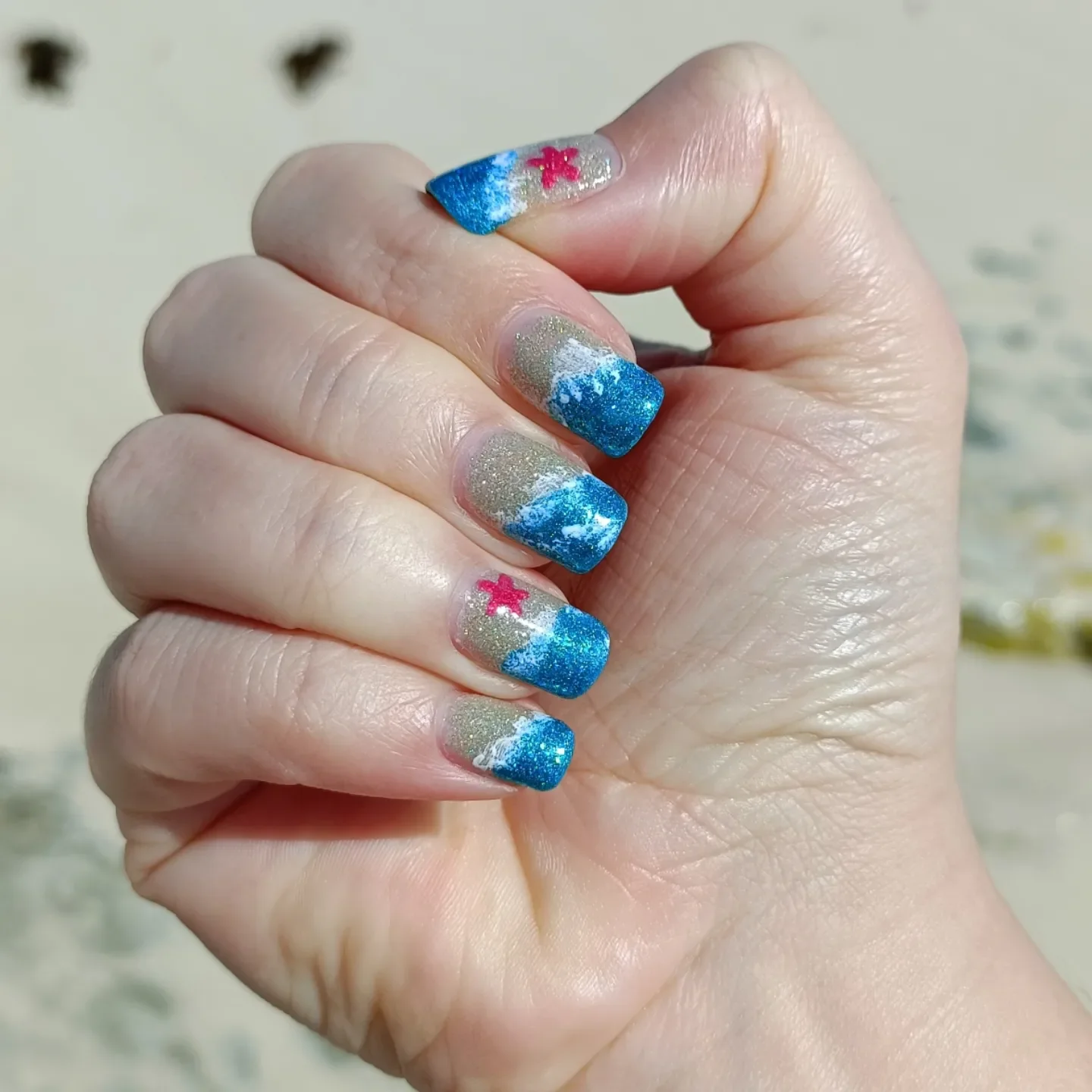 summer beach nails 2026 Blue Ocean Wave Nails With Glitter Sand Details