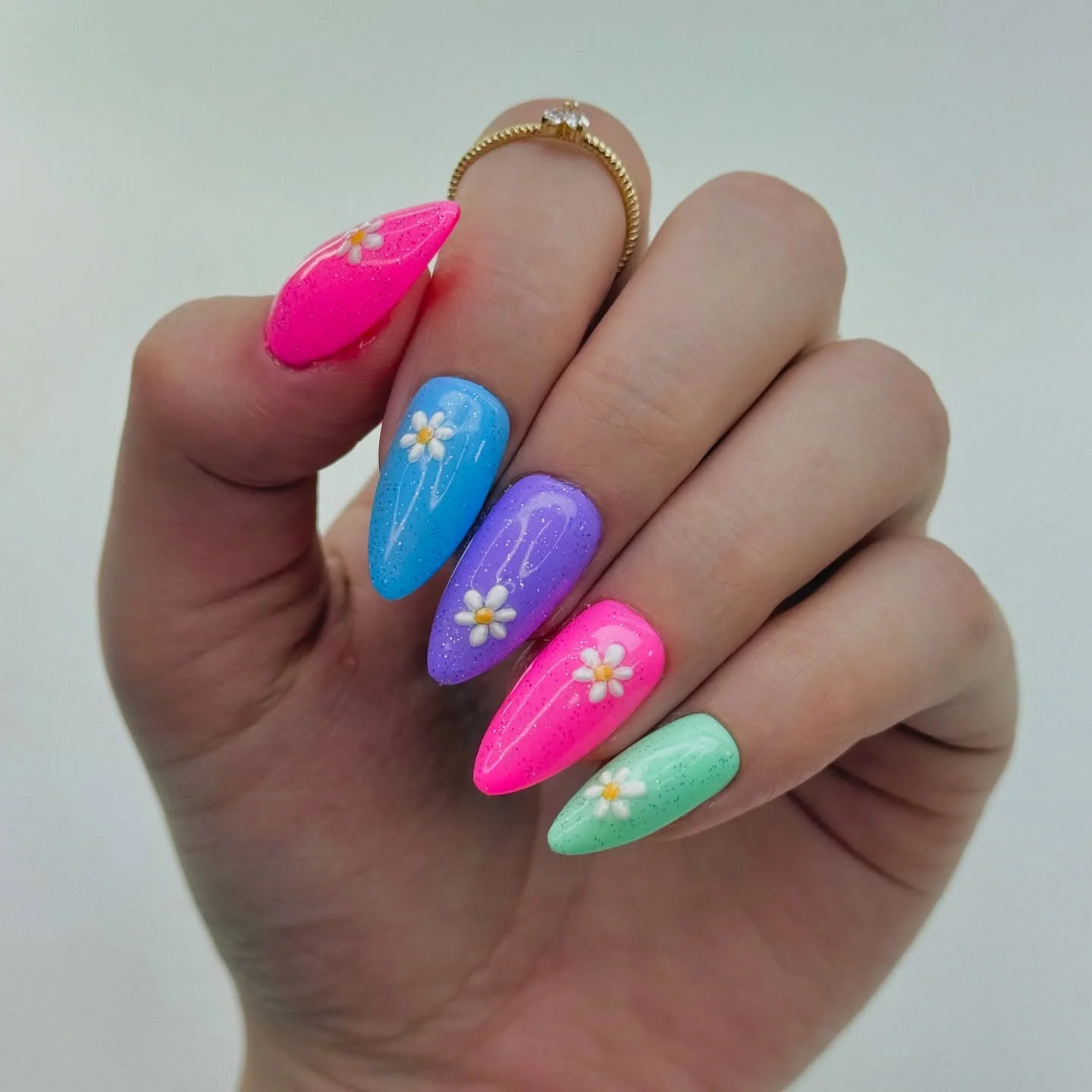 summer vibrant nails 2026 Pastel Daisy Almond Nails With Glitter Finish