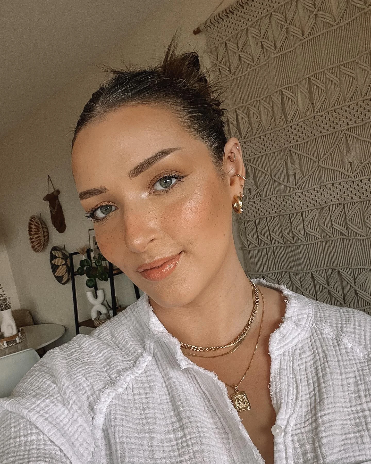 flattering summer quick hairstyles 2026 Soft Slicked Buns Feel Cleaner Than Heavy Glam Right Now