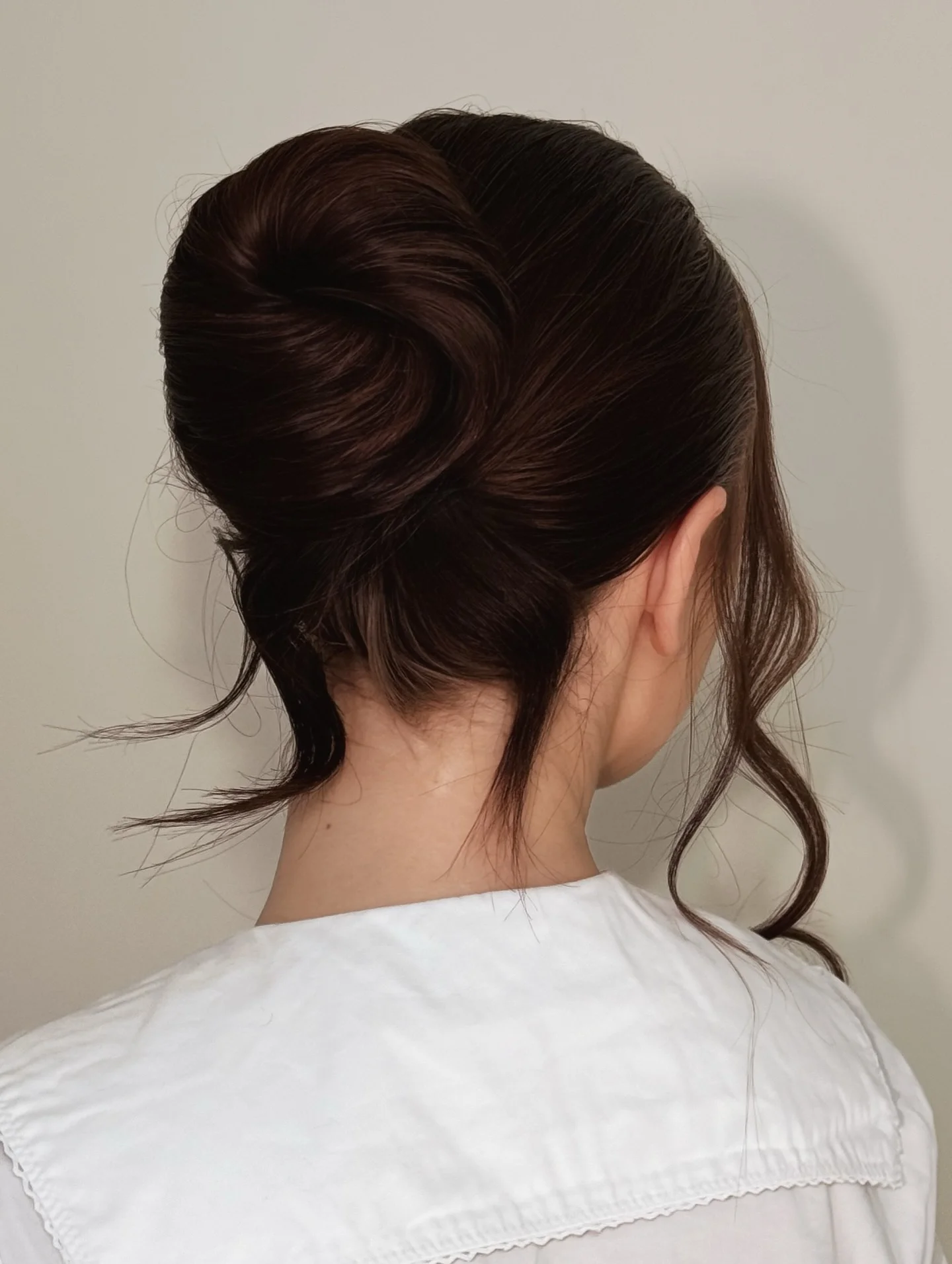 summer hairstyles ideas 2026 Glossy Twisted Bun With Minimalist Elegance