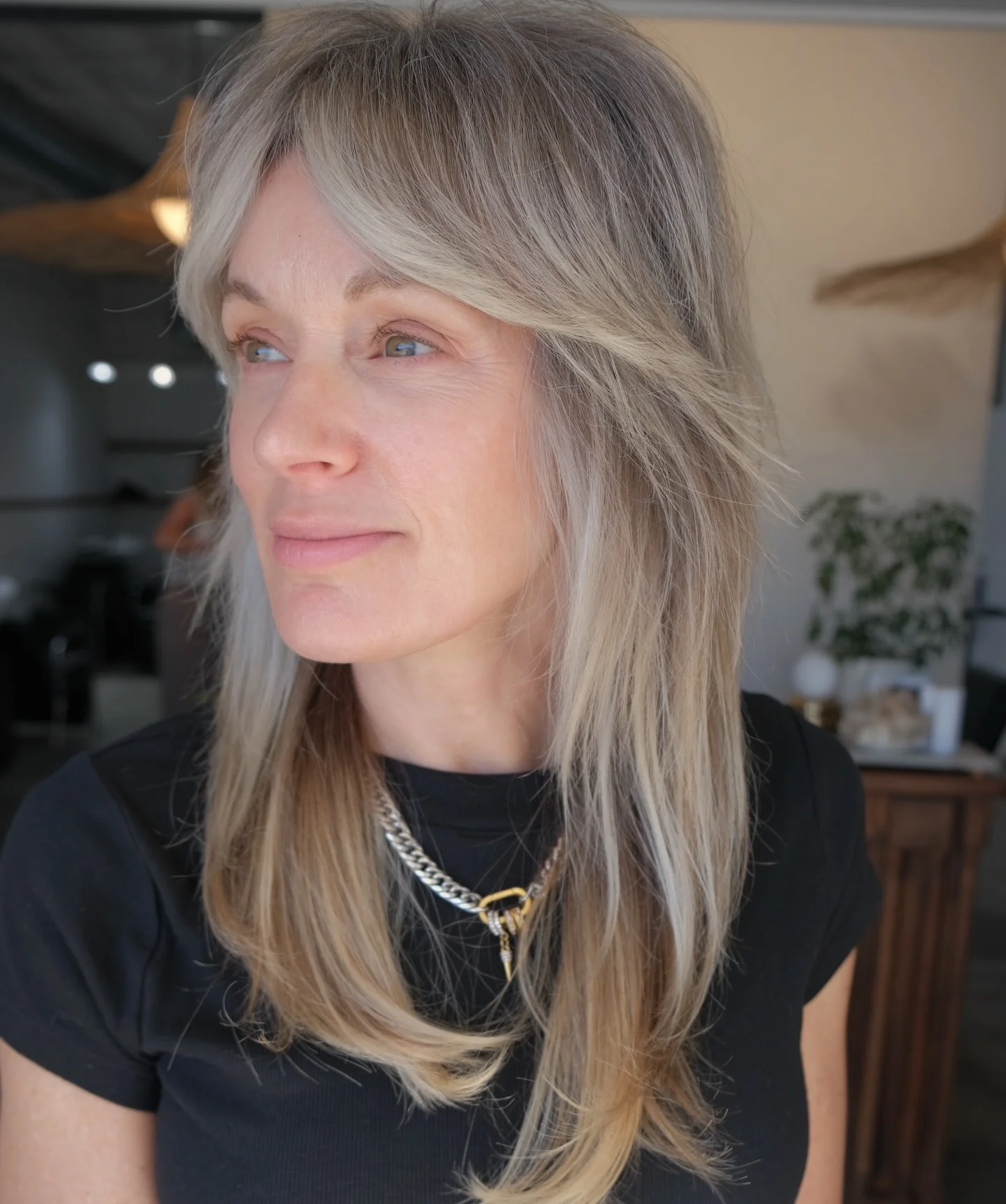 stylish summer haircuts for women over 60 2026 Feathered Medium Shag With Curtain Bangs