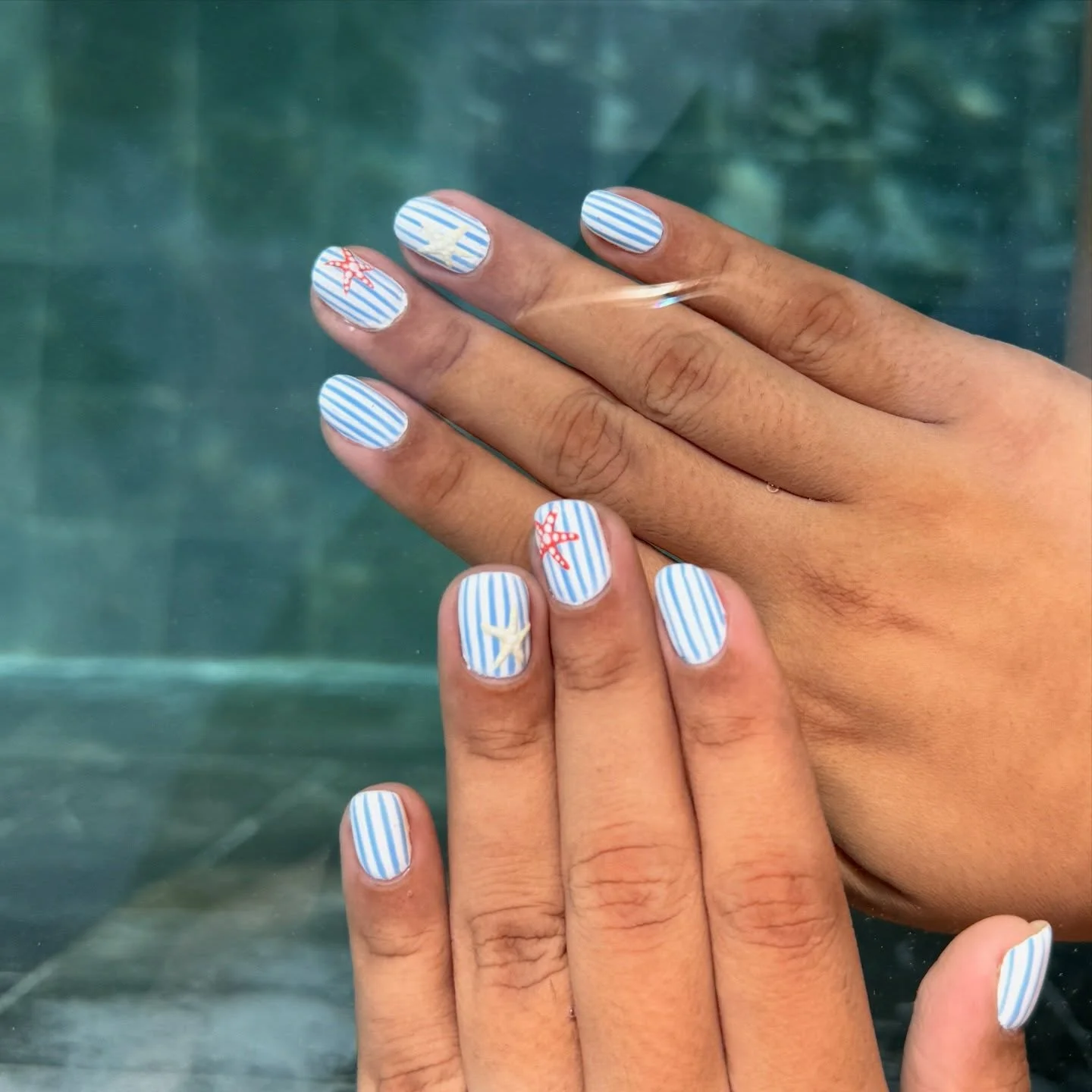 summer beach nails 2026 Blue Coastal Stripe Nails That Feel Straight Out Of Capri