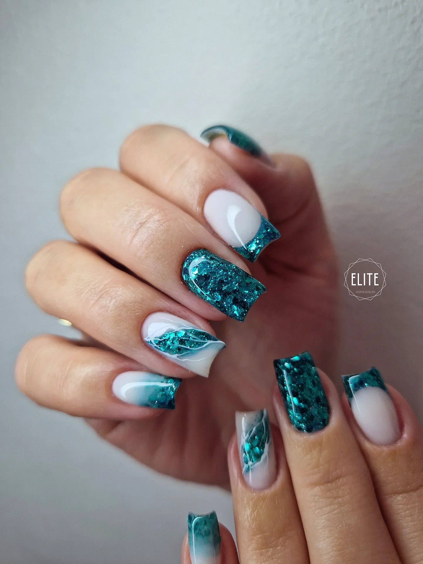 summer glitter nails 2026 Emerald Glitter French With Modern Drama