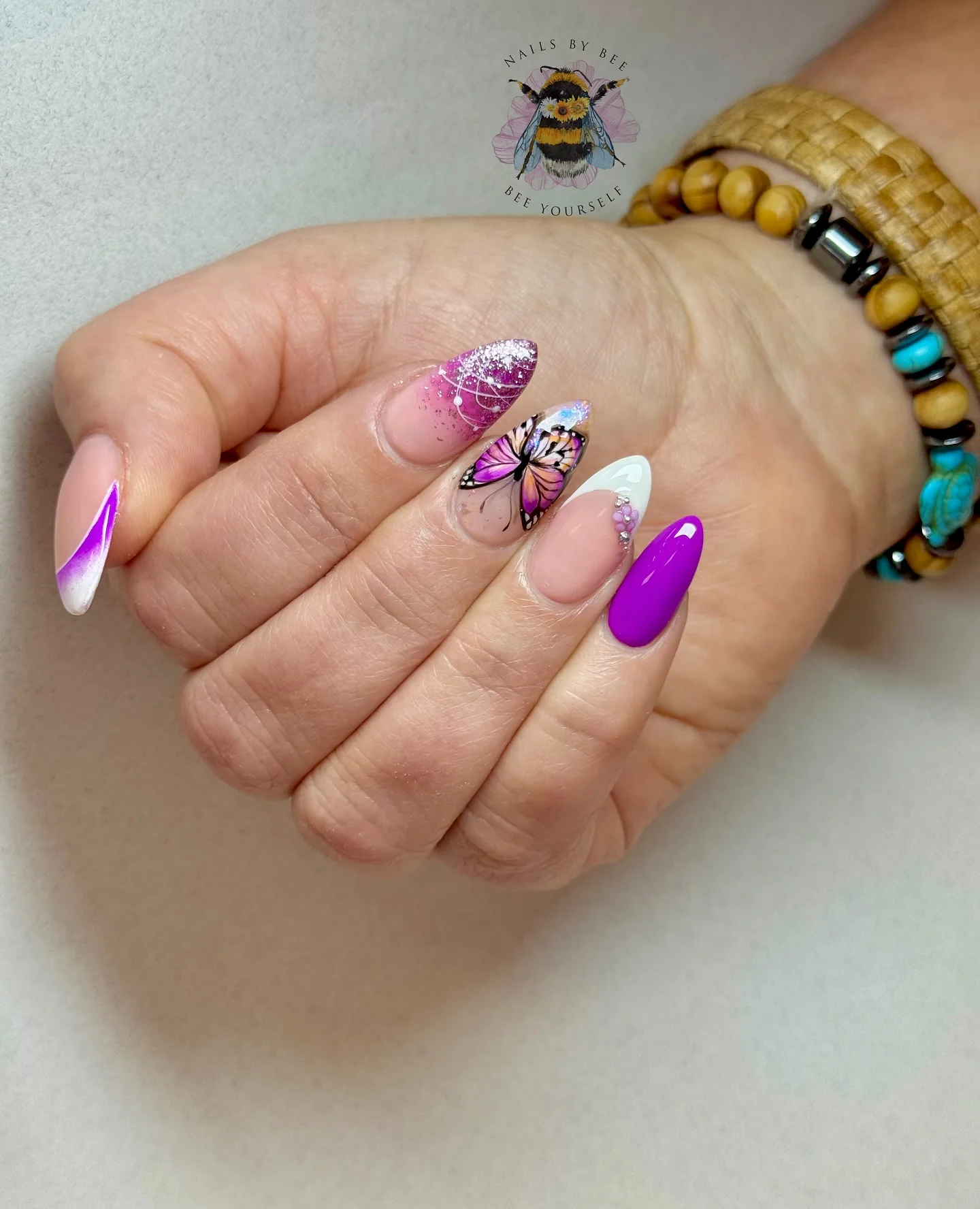 summer nail art 2026 Butterfly Chrome Nails With Violet Glow