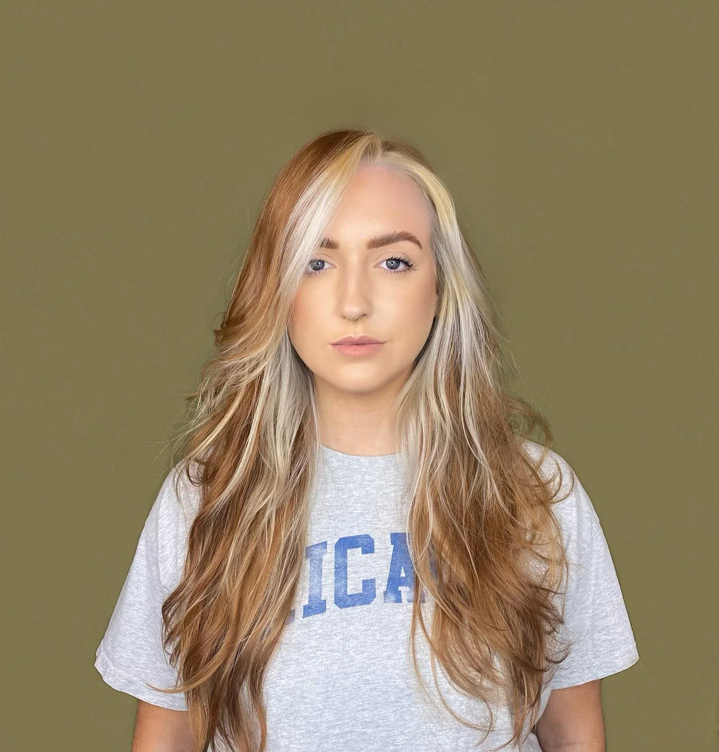 platinum summer money piece hair color 2026 Warm Copper Blonde Money Piece With Retro Volume