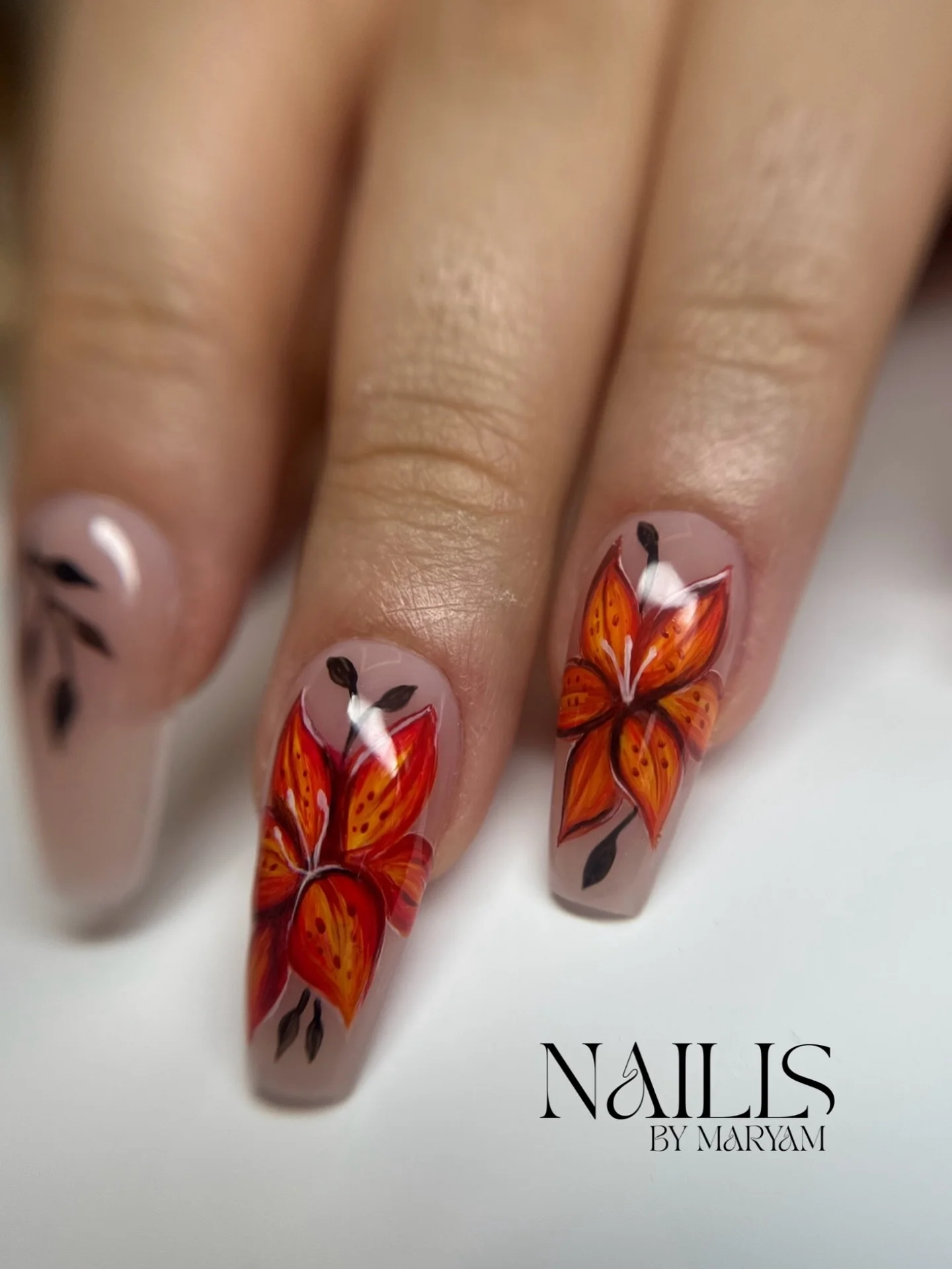 summer flower nails 2026 Orange Lily Nail Art With A Dramatic Glossy Finish