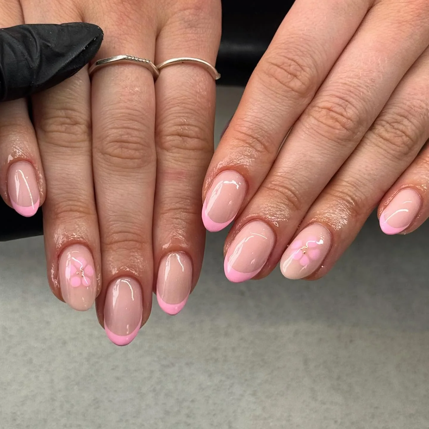 light summer nails 2026 Glossy Baby Pink French Tips With Tiny Blossoms