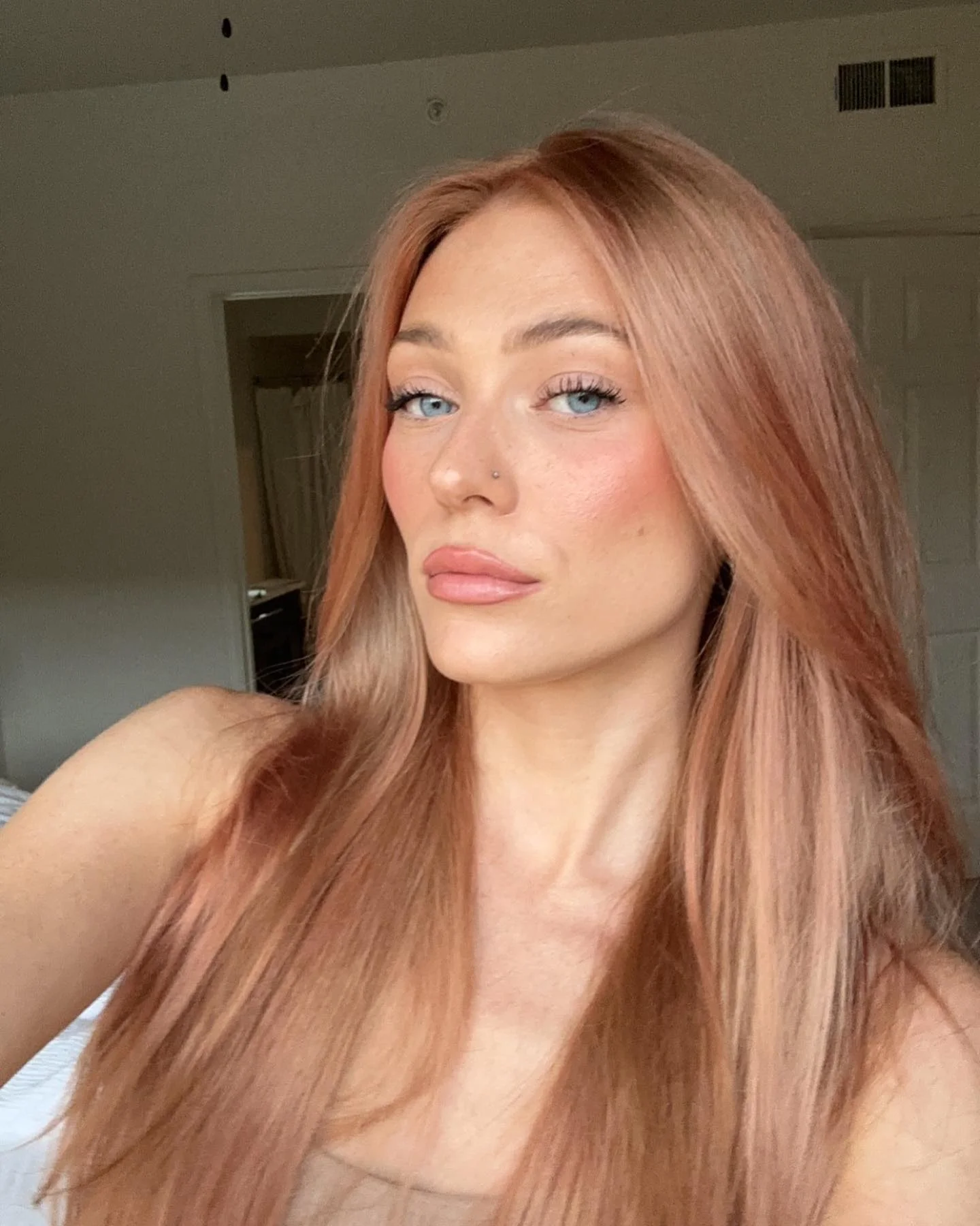 lived-in summer strawberry blonde hair color 2026 Rose Quartz Strawberry Blonde With Peachy Summer Glow