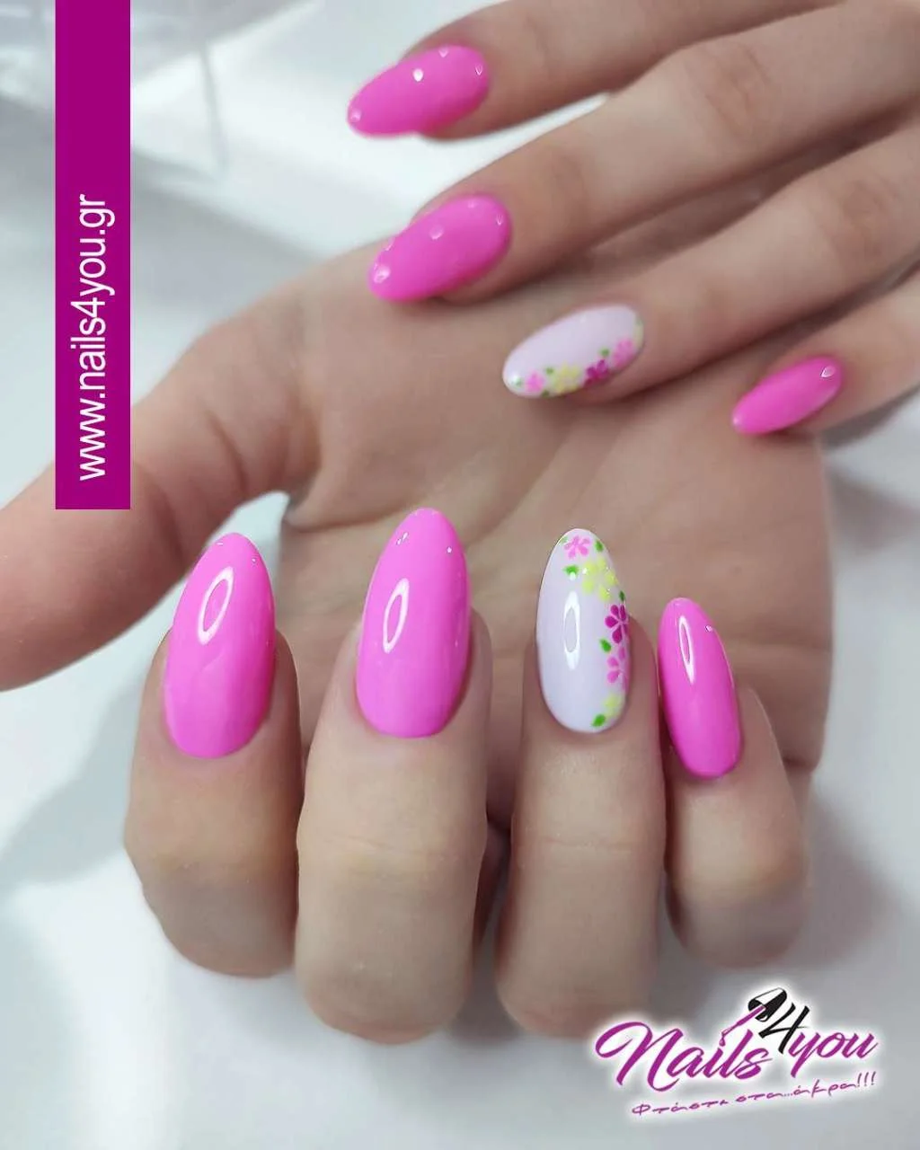 pink summer nails 2026 Simple Glossy Pink Almond Nails With Tiny Floral Accents