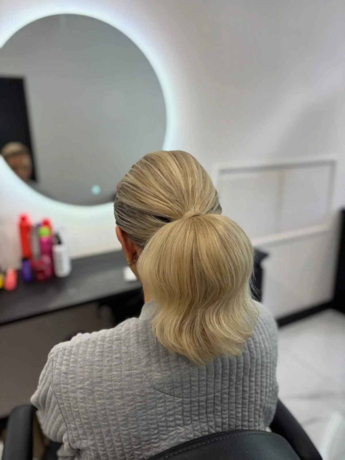 polished summer ponytail hairstyle 2026 Short Blonde Bubble Ponytail With Minimalist Finish