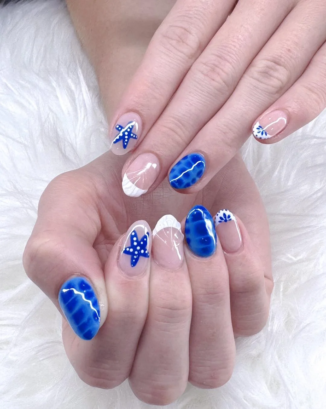 trendy summer nails 2026 Deep Ocean Blue Nails With Coastal Starfish Art