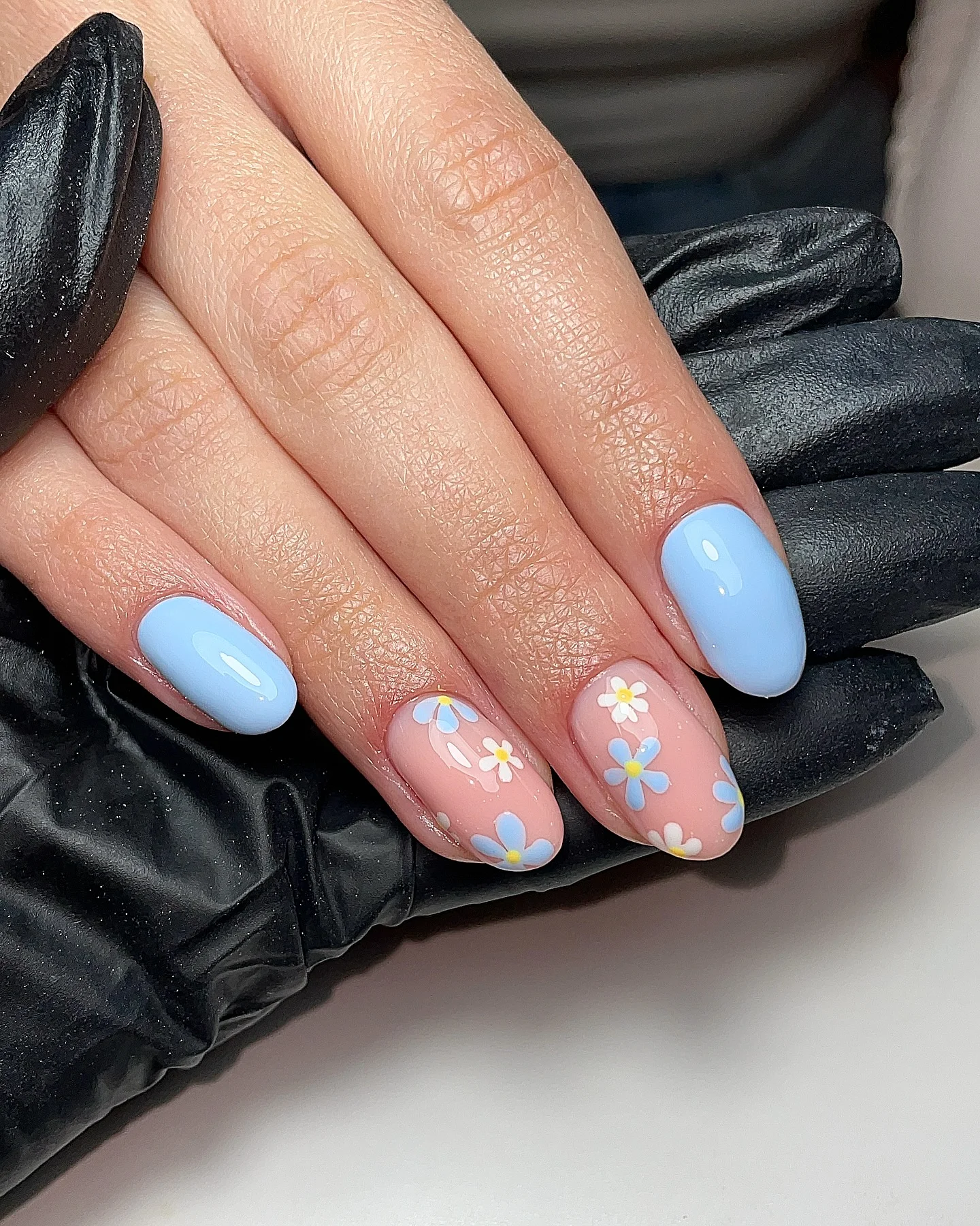 light summer nails 2026 Powder Blue Daisy Nails With A Soft Gloss Finish
