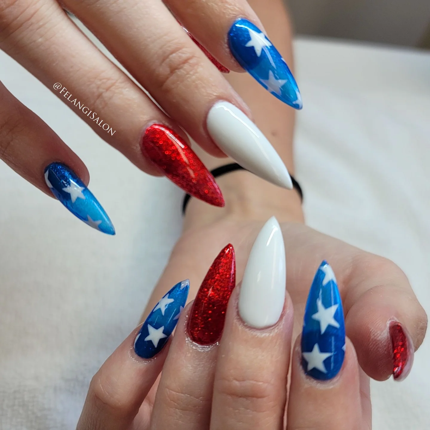 patriotic nails 2026 Glazed Red White And Blue Stiletto Nails