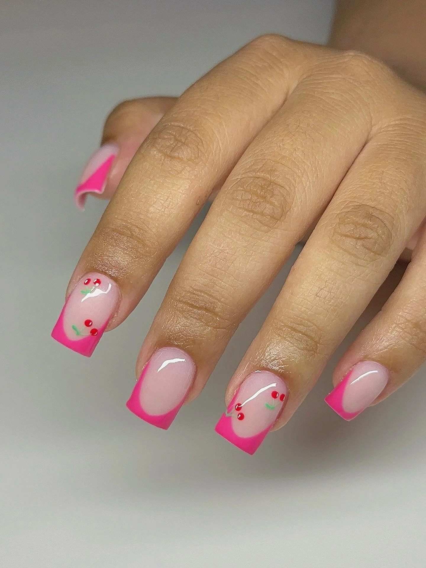 pink summer nails 2026 Pink French Tips With Tiny Cherry Nail Art