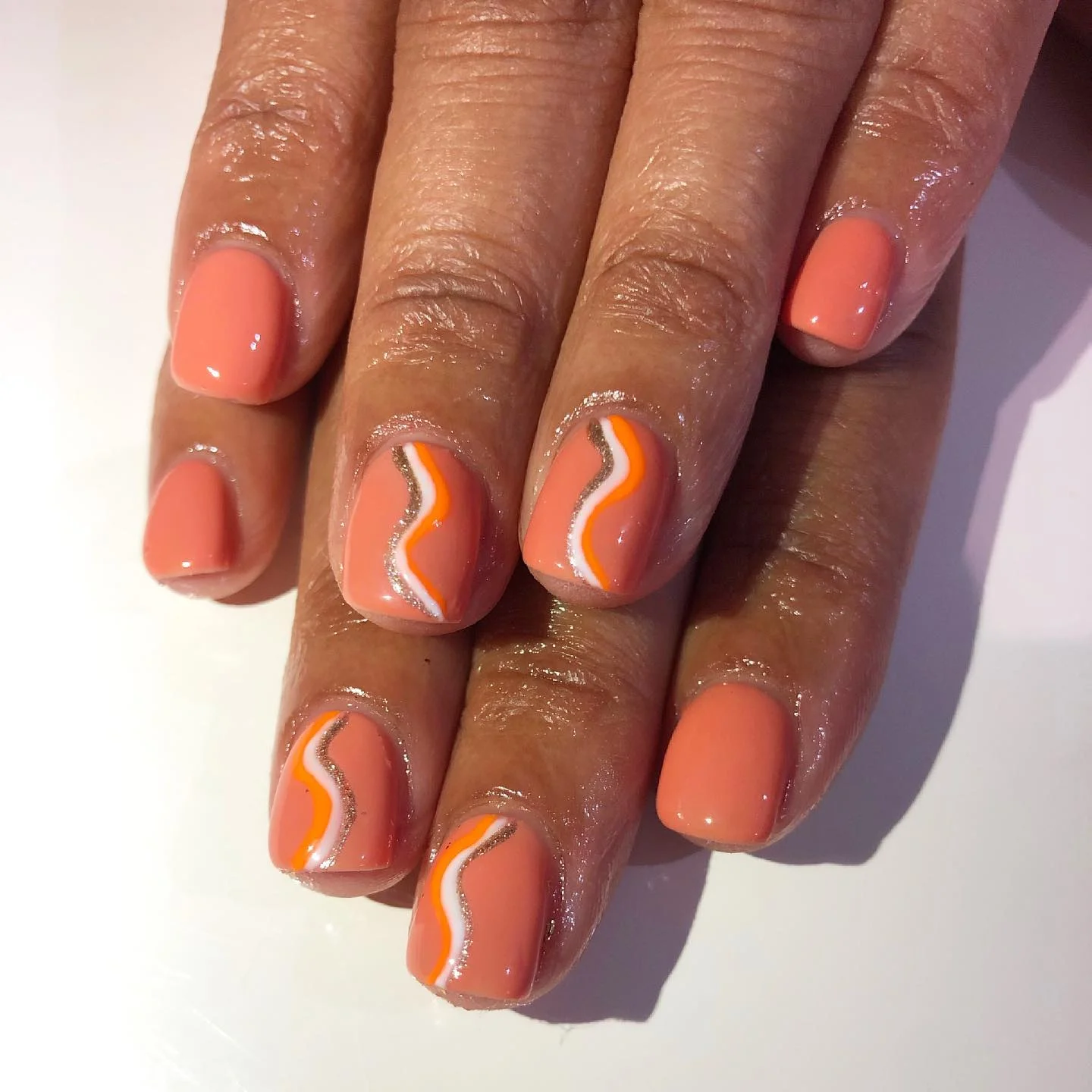 short squoval nails design 2026 Peach Swirl Nails With Retro Chic Appeal