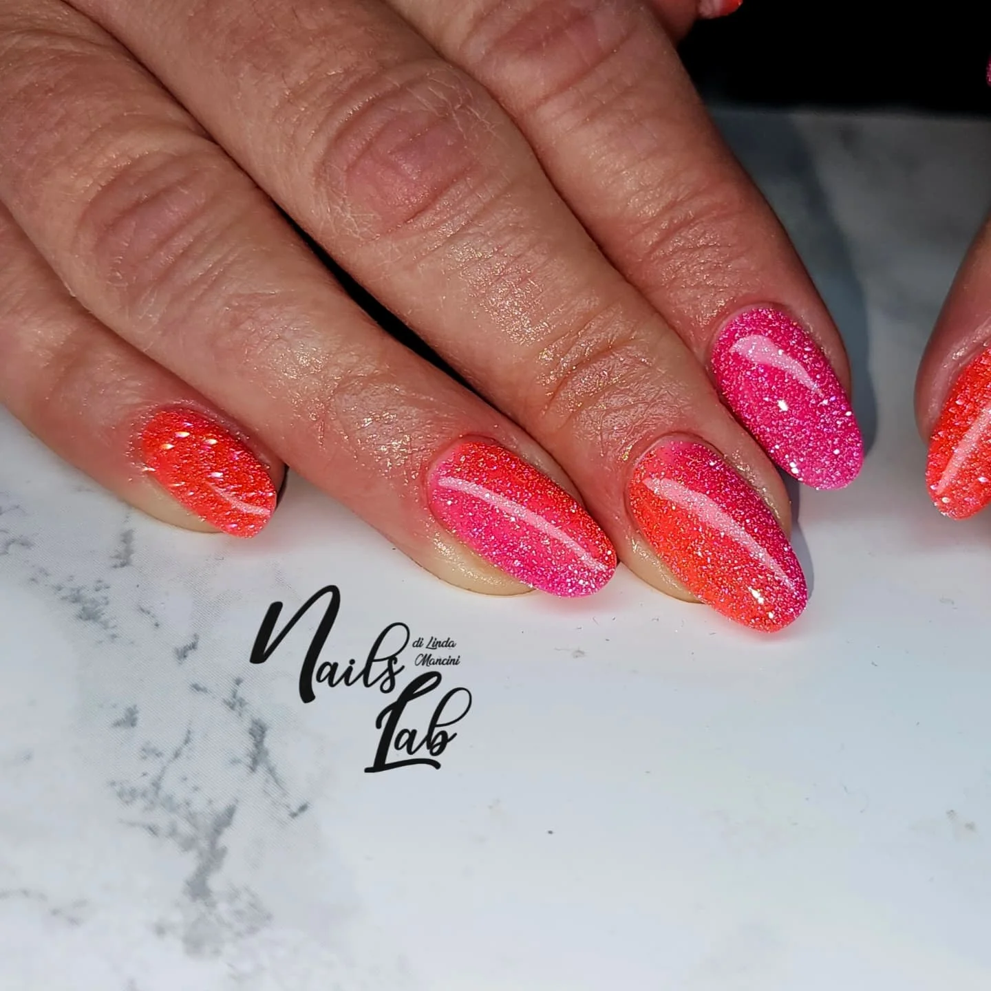 summer glitter nails 2026 Neon Pink And Coral Glitter Mix For A Tropical Finish