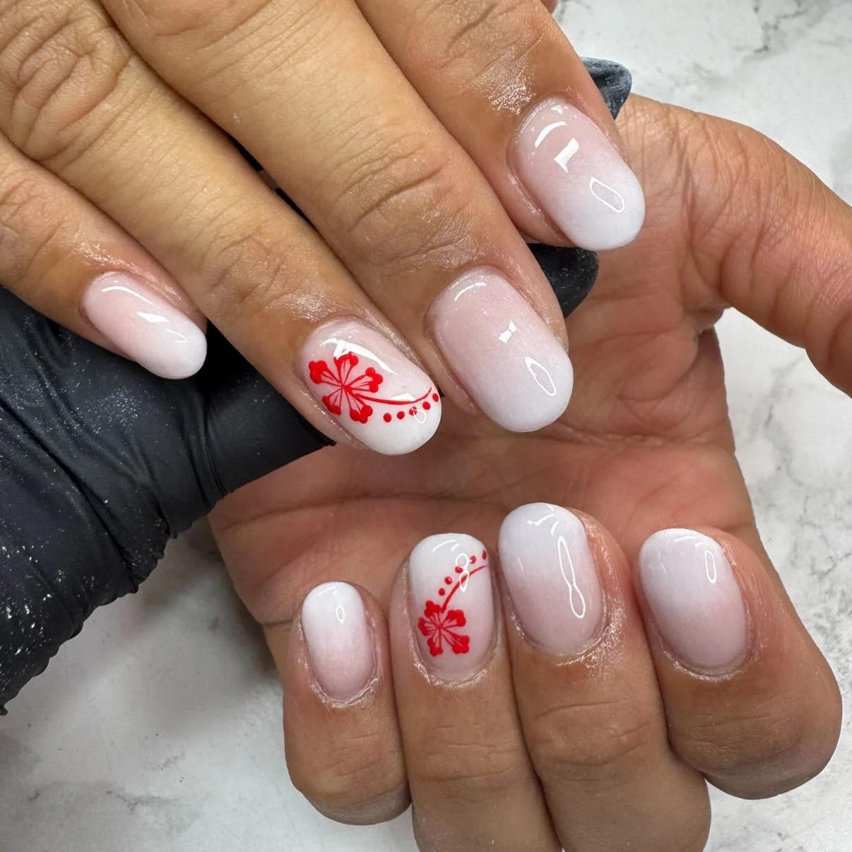 light summer nails 2026 Soft White Gloss Nails With Minimal Red Floral Art