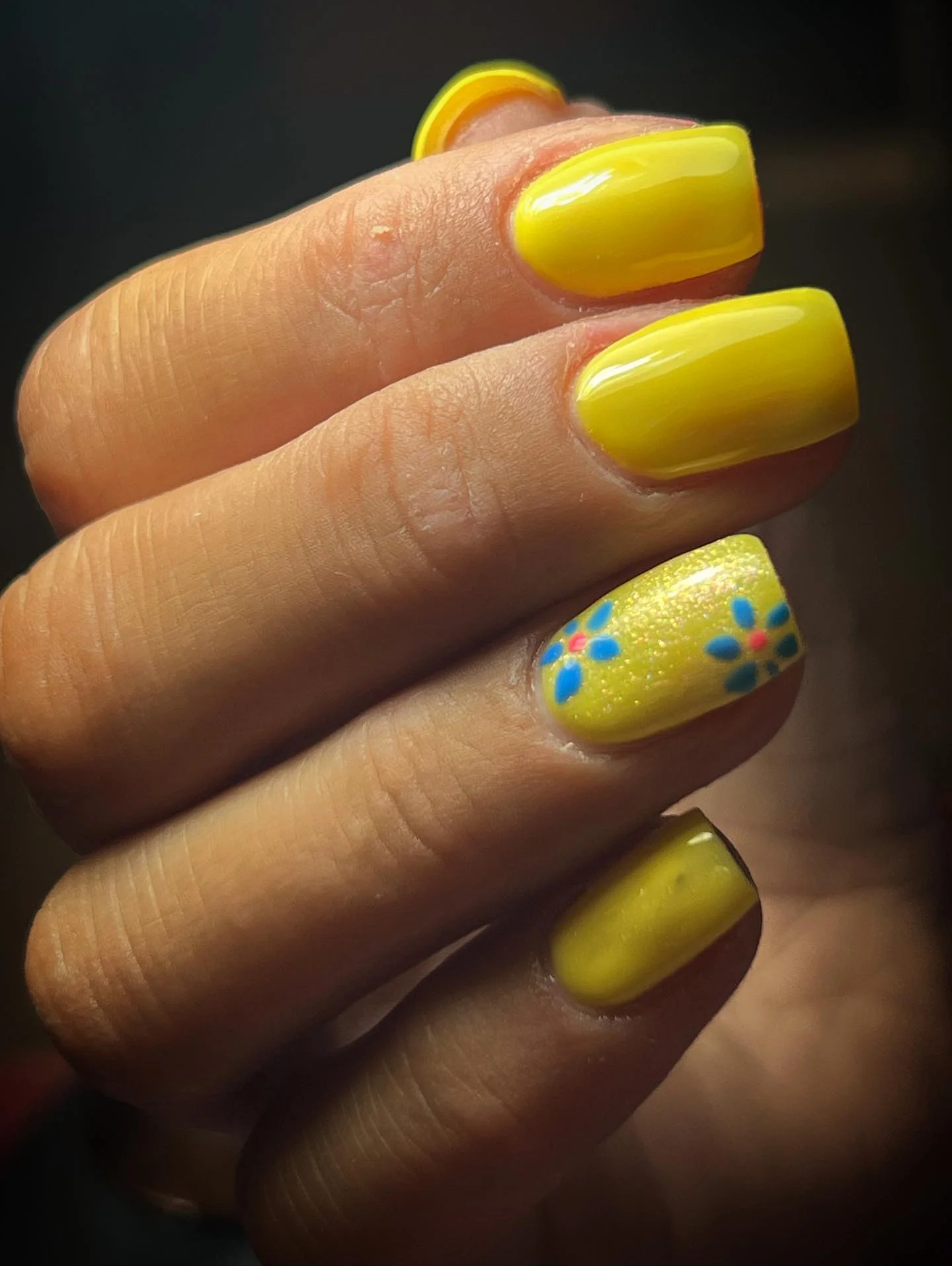 summer yellow nails 2026 Glossy Neon Lemon Nails With Minimal Floral Accent Art