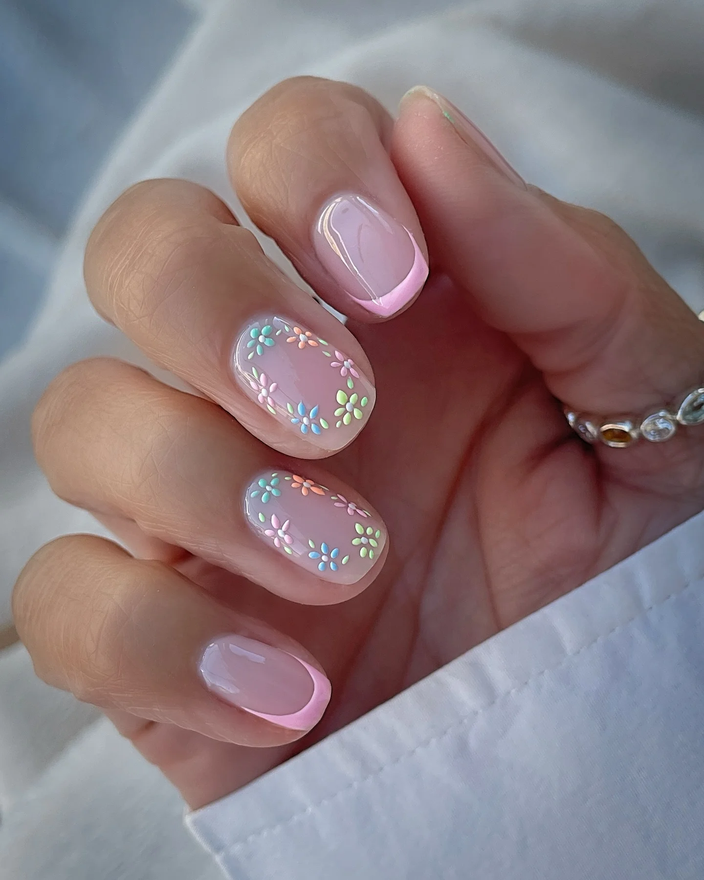 light summer nails 2026 Pastel Daisy Nails With Soft Pink French Tips