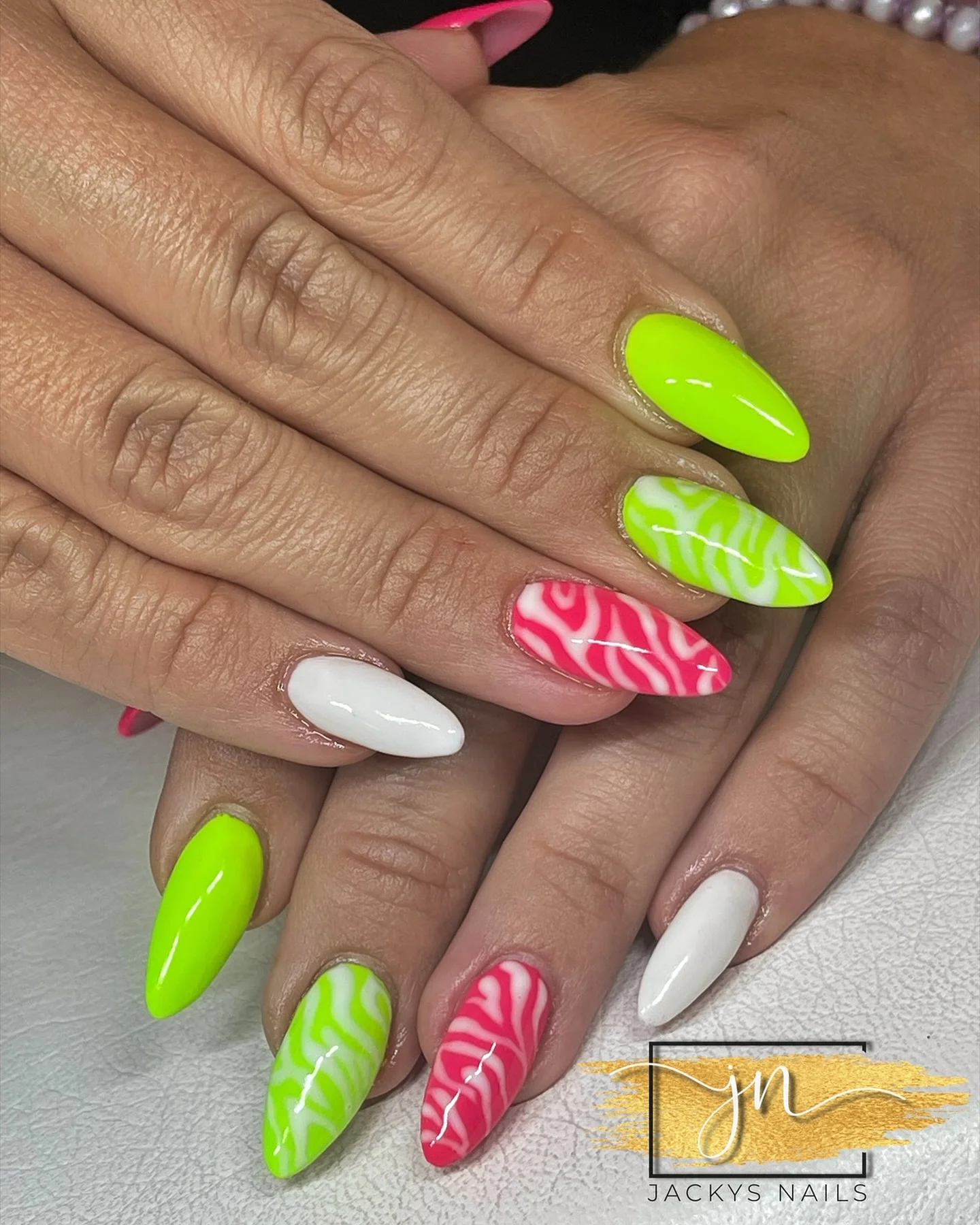 neon summer nails 2026 Glossy Lime And Pink Zebra Nails With A Tropical Twist